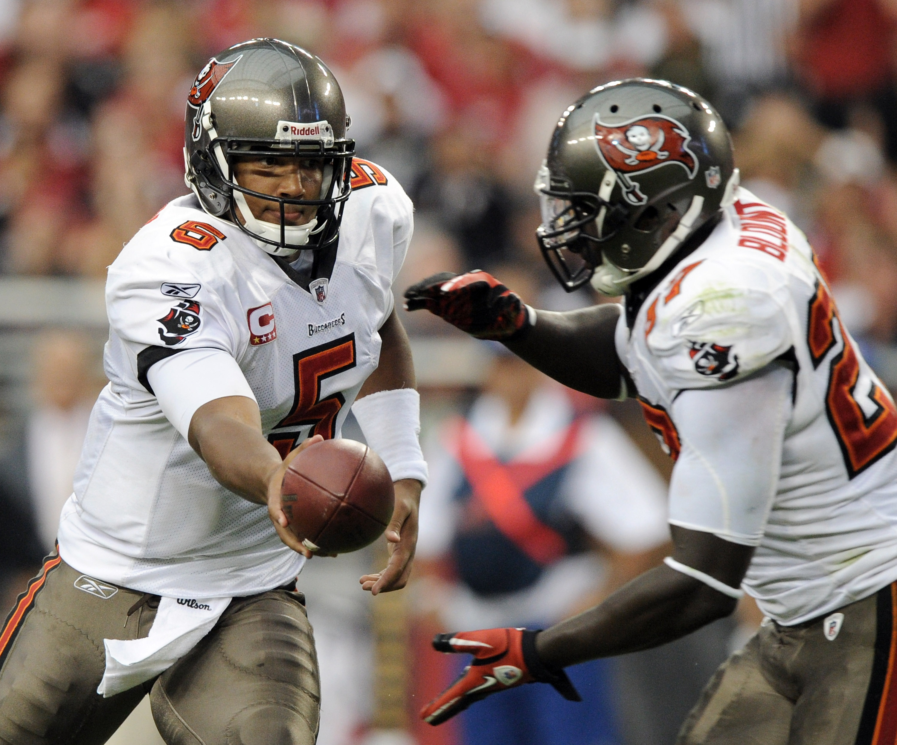 GLENDALE, AZ - OCTOBER 31:  Josh Freeman #5 of the Tampa Bay Buccaneers hands off to LeGarrette Blount #27 against the Arizona Cardinals during the third quarter at University of Phoenix Stadium on October 31, 2010 in Glendale, Arizona.  (Photo by Harry H