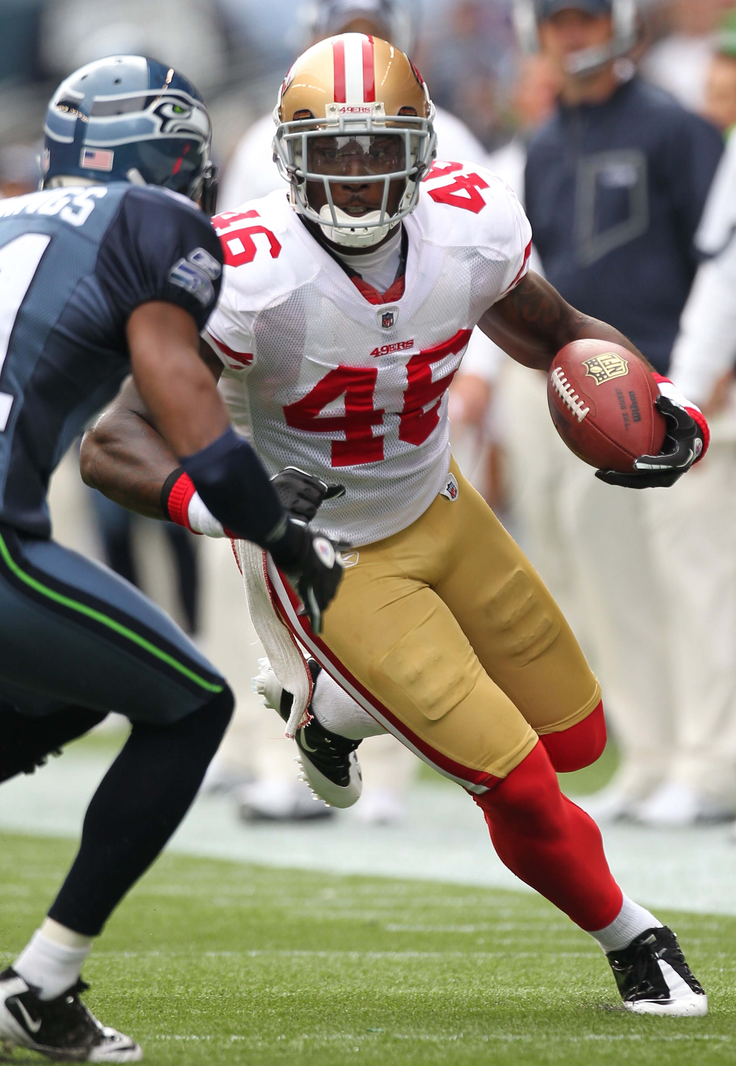 SEATTLE - SEPTEMBER 12:  Delanie Walker #46 of the San Francisco 49ers rushes against the Seattle Seahawks during the NFL season opener at Qwest Field on September 12, 2010 in Seattle, Washington. (Photo by Otto Greule Jr/Getty Images)