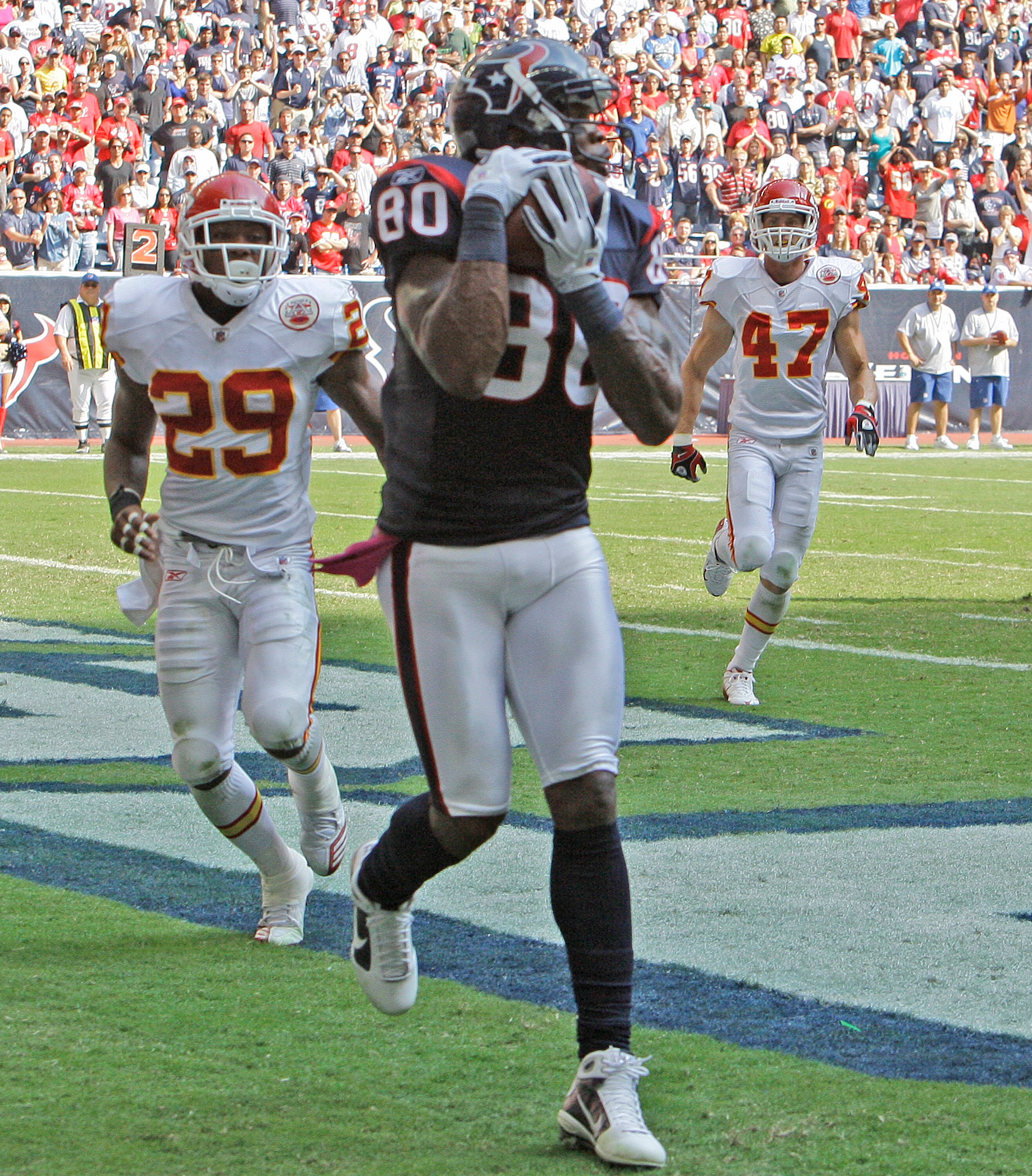HOUSTON - OCTOBER 17:  Andre Johnson #80 of the Houston Texans reals in an eight yard reception as he beats cornerback safety Eric Berry #29 onn the play at Reliant Stadium on October 17, 2010 in Houston, Texas.Houston won 35-31.  (Photo by Bob Levey/Gett