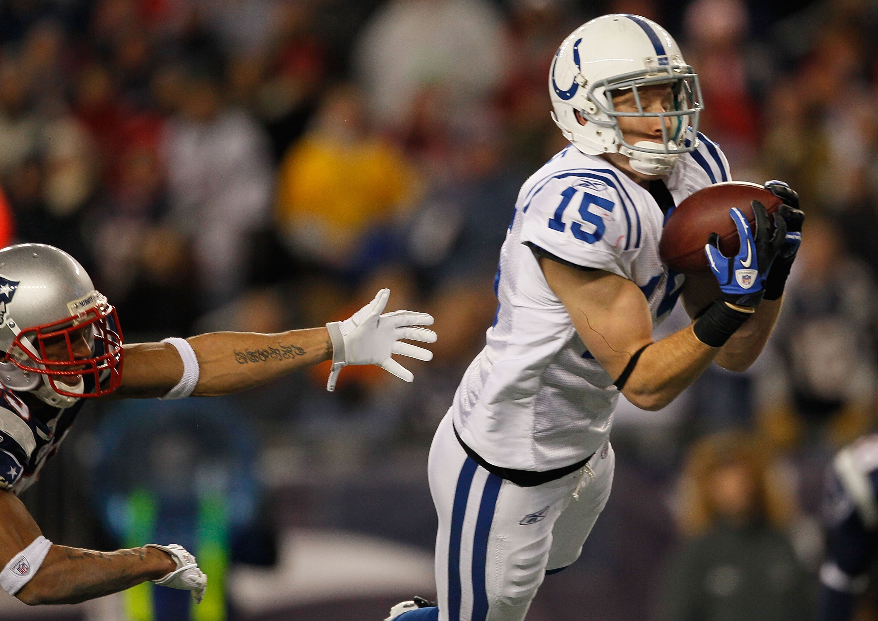FOXBORO, MA - NOVEMBER 21:  Blair White #15 of the Indianapolis Colts catches a touchdown pass against the New England Patriots in the second half at Gillette Stadium on November 21, 2010 in Foxboro, Massachusetts. (Photo by Jim Rogash/Getty Images)