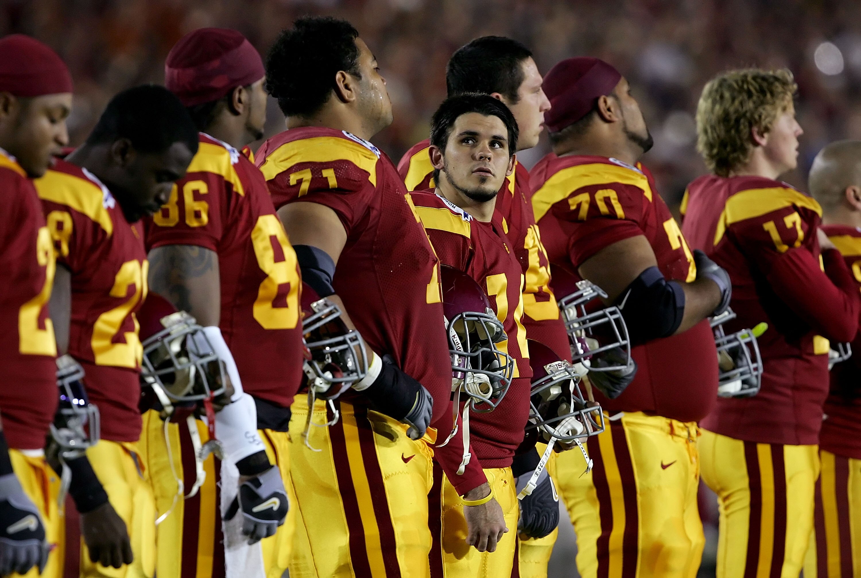 PASADENA, CA - JANUARY 04:  Kicker Mario Danelo #19, center, of the USC Trojans looks to the stands during the national anthem before the start of the BCS National Championship Rose Bowl Game between the Trojans and the Texas Longhorns at the Rose Bowl on