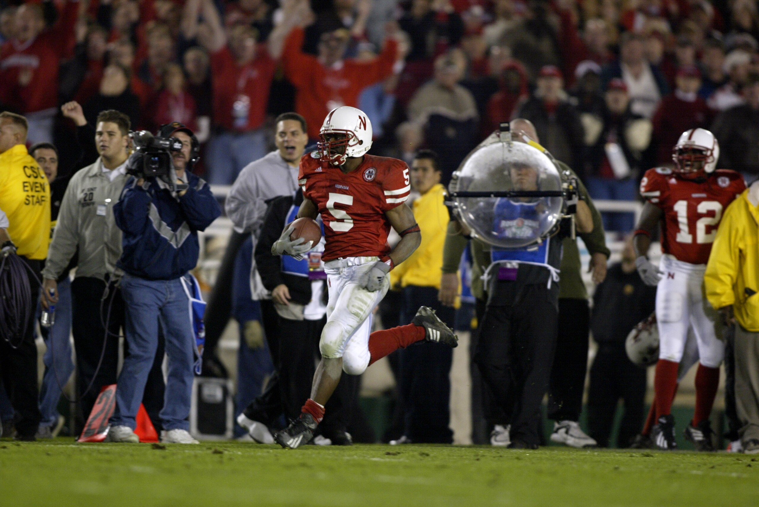 3 Jan 2002:    DeJuan Groce #5 of Nebraska runs up the sidelines for a touchdown on a kick return scoring Nebraska's second during the Rose Bowl National Championship game against Miami at the Rose Bowl in Pasadena, California.  Miami won the game 37-14,