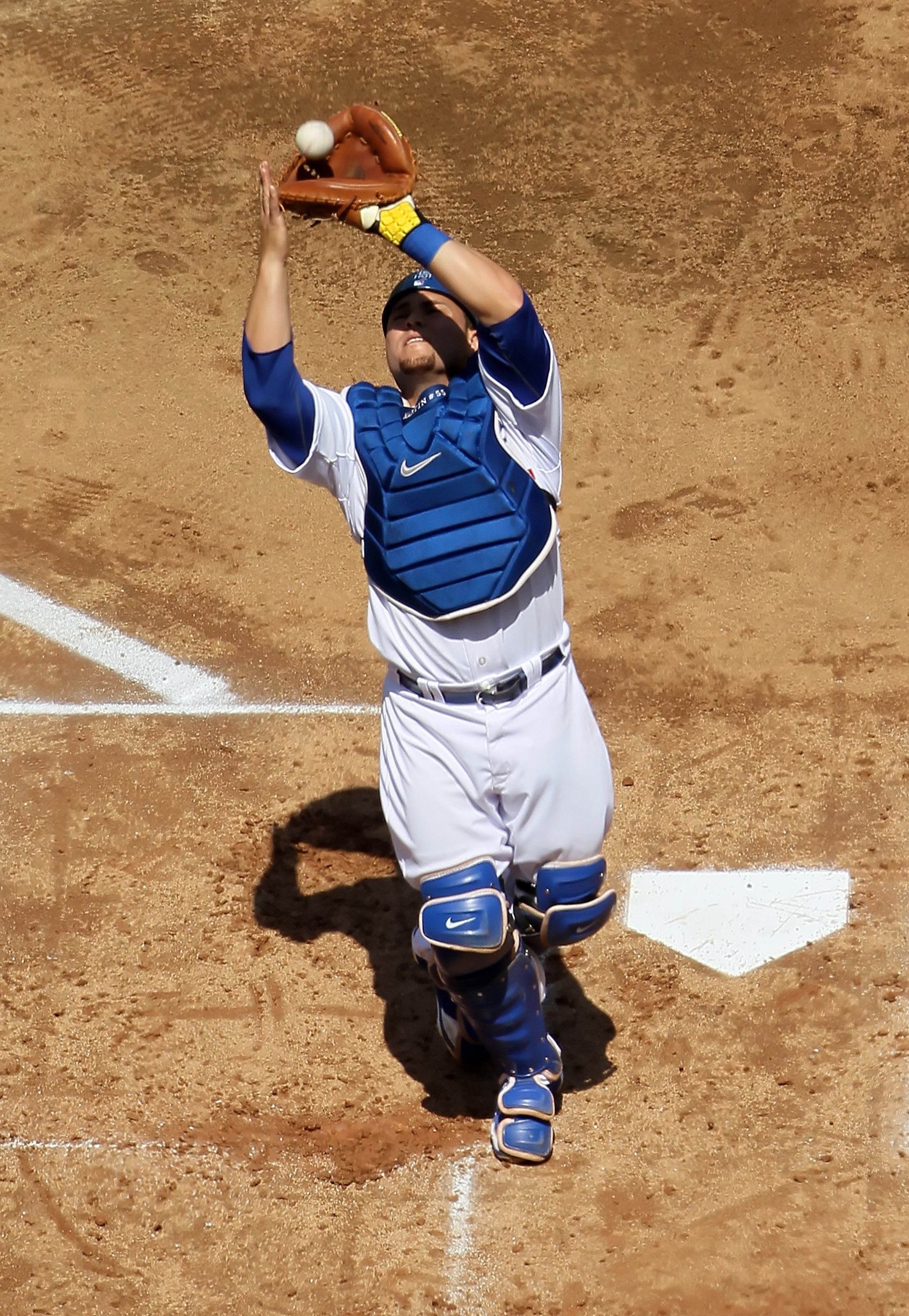 LOS ANGELES, CA - APRIL 13:  Russell Martin #55 of the Los Angeles Dodgers makes a catch against the Arizona Diamondbacks at Dodger Stadium on April 13, 2010 in Los Angeles, California.  (Photo by Jeff Gross/Getty Images)