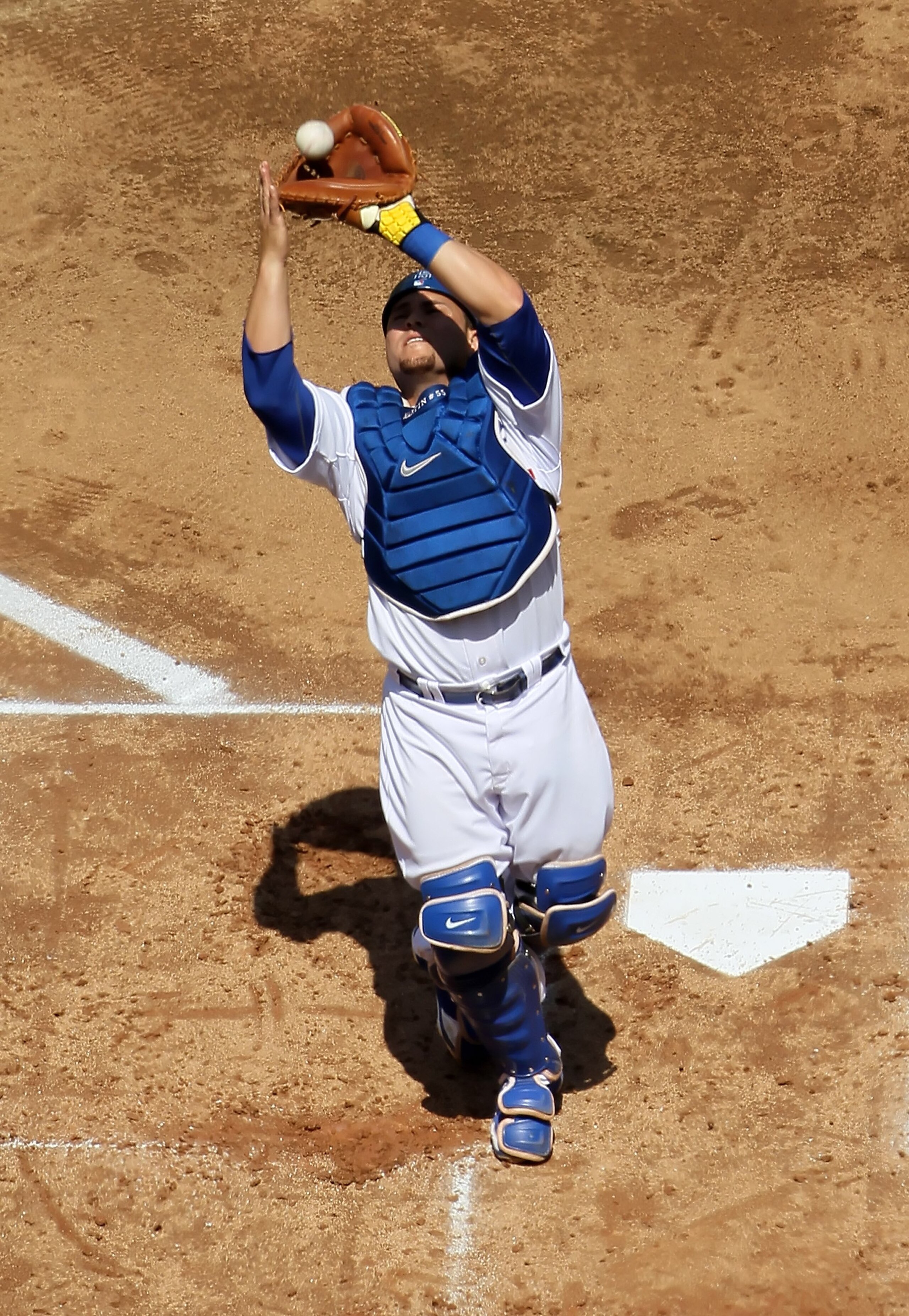 LOS ANGELES, CA - APRIL 13:  Russell Martin #55 of the Los Angeles Dodgers makes a catch against the Arizona Diamondbacks at Dodger Stadium on April 13, 2010 in Los Angeles, California.  (Photo by Jeff Gross/Getty Images)