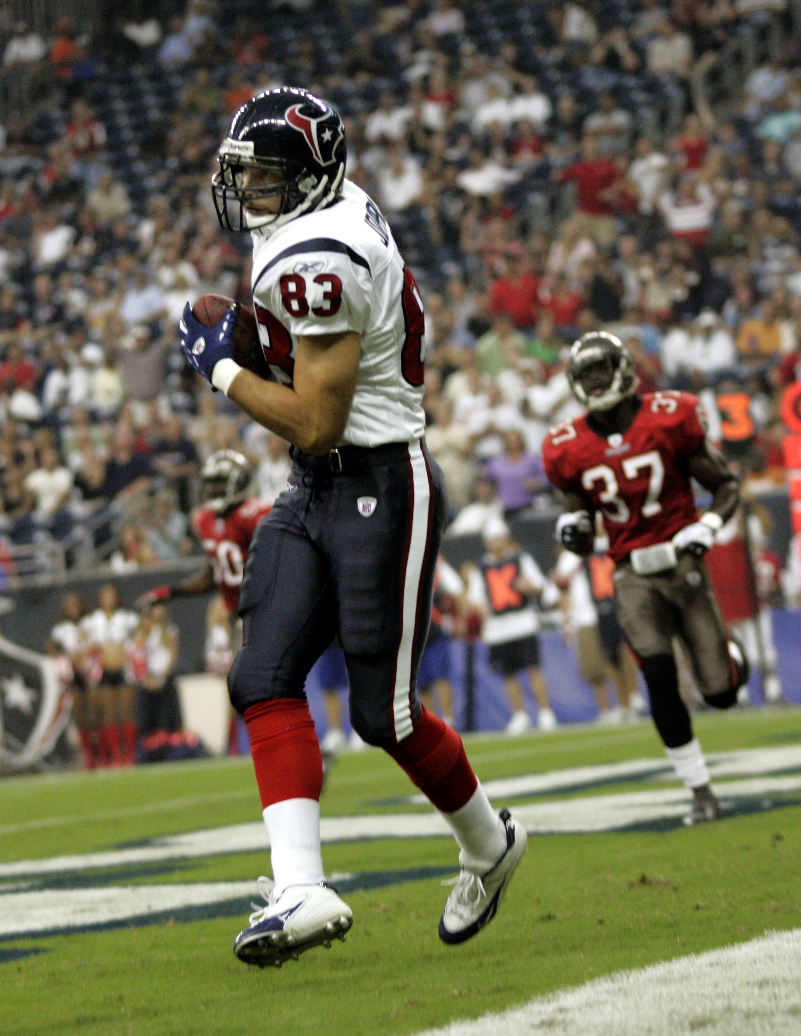 HOUSTON - AUGUST 31:  Bennie Joppru #83 of the Houston Texans catches a touchdown pass against Steve Cargile #37 of the Tampa Bay Buccaneers during a preseason game August 31, 2006 at Reliant Stadium in Houston, Texas.  (Photo by Layne Murdoch/Getty Image