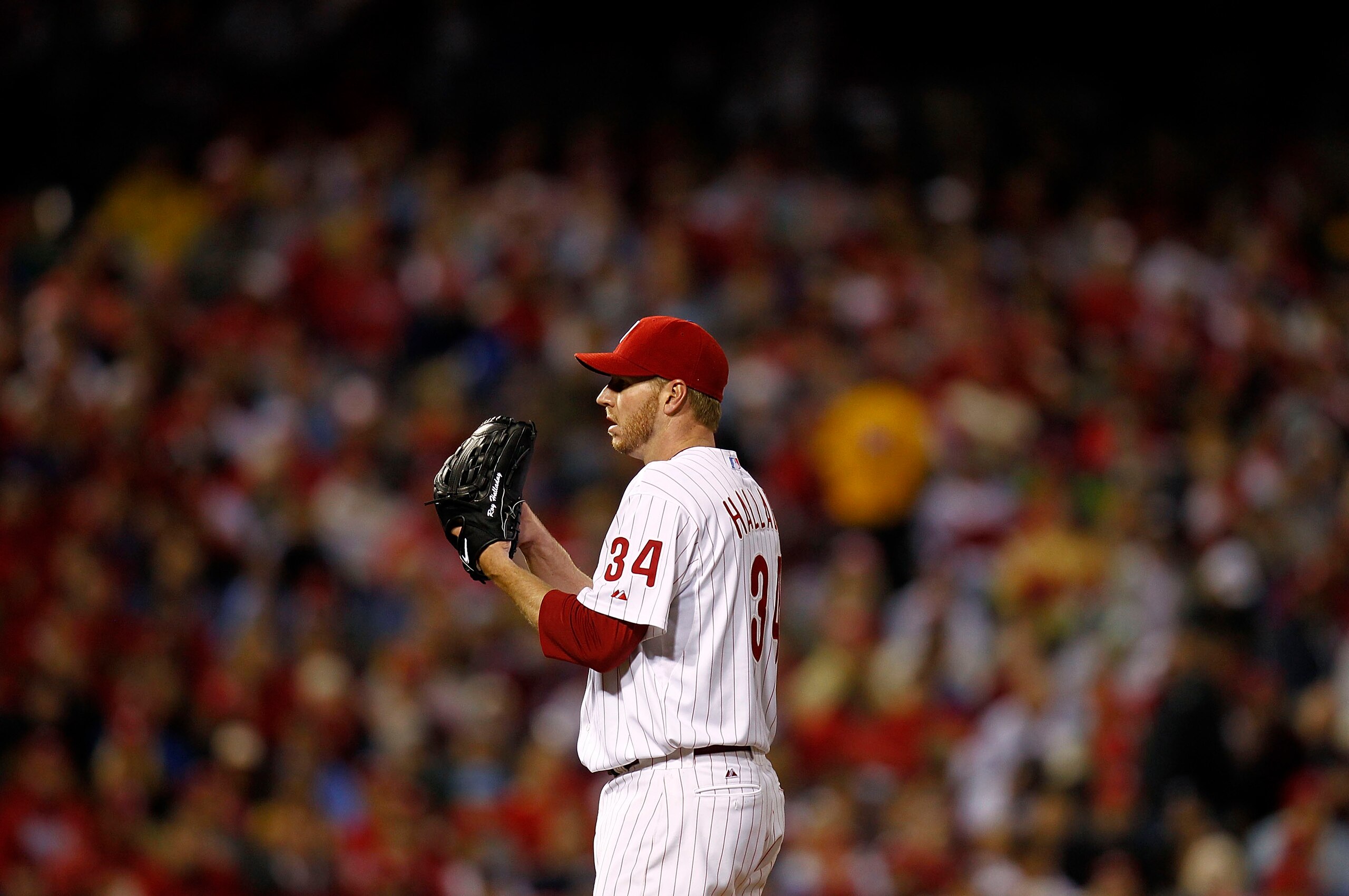 PHILADELPHIA - OCTOBER 06:  Roy Halladay #34 of the Philadelphia Phillies delivers in Game 1 of the NLDS against the Cincinnati Reds at Citizens Bank Park on October 6, 2010 in Philadelphia, Pennsylvania.  (Photo by Jeff Zelevansky/Getty Images)