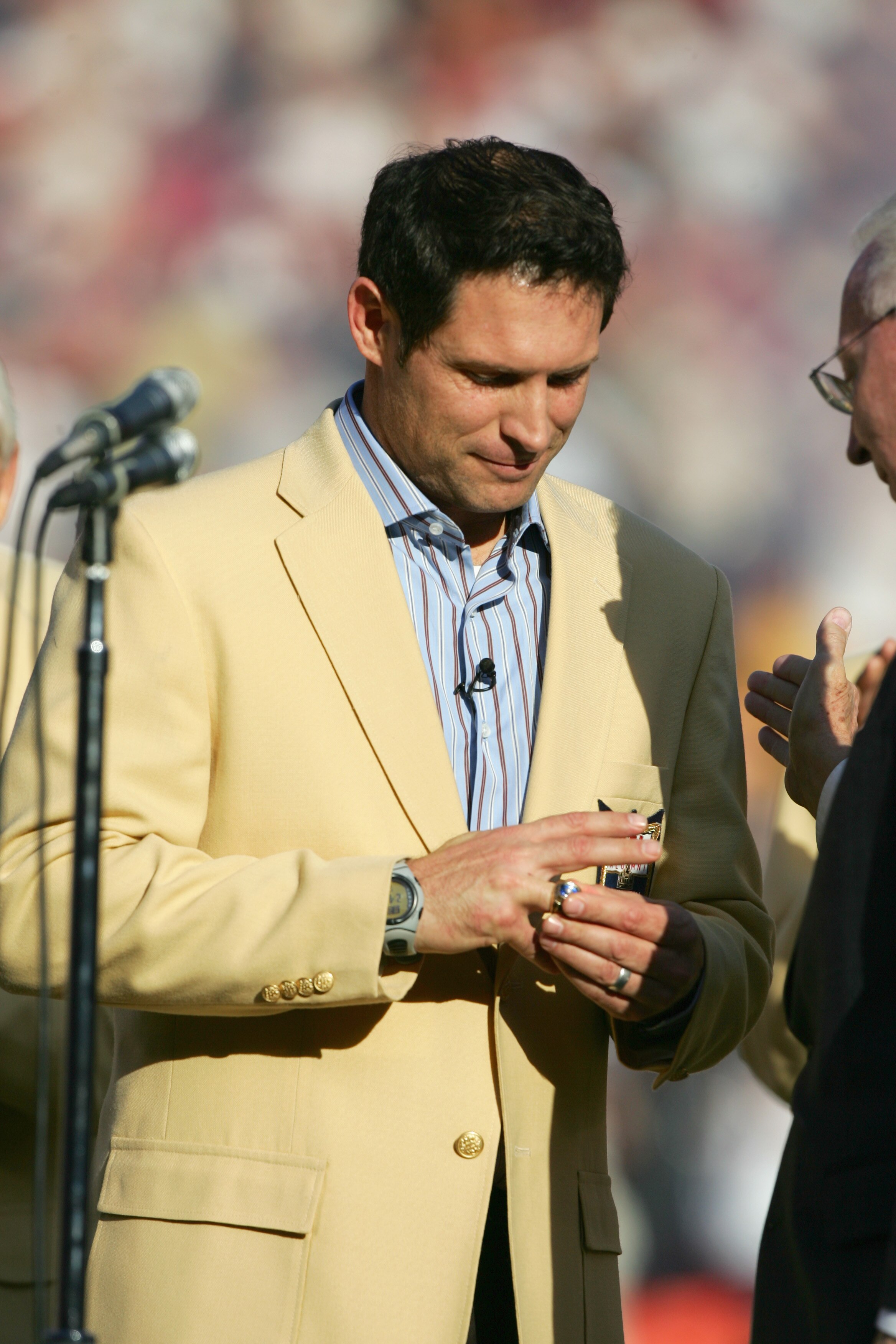 SAN FRANCISCO - NOVEMBER 20: Steve Young puts on the Hall of Fame ring as the 49ers celebrate his induction into the Hall of Fame at halftime during the NFL game between the San Francisco 49ers and the Seattle Seahawks on November 20, 2005 at Monster Park