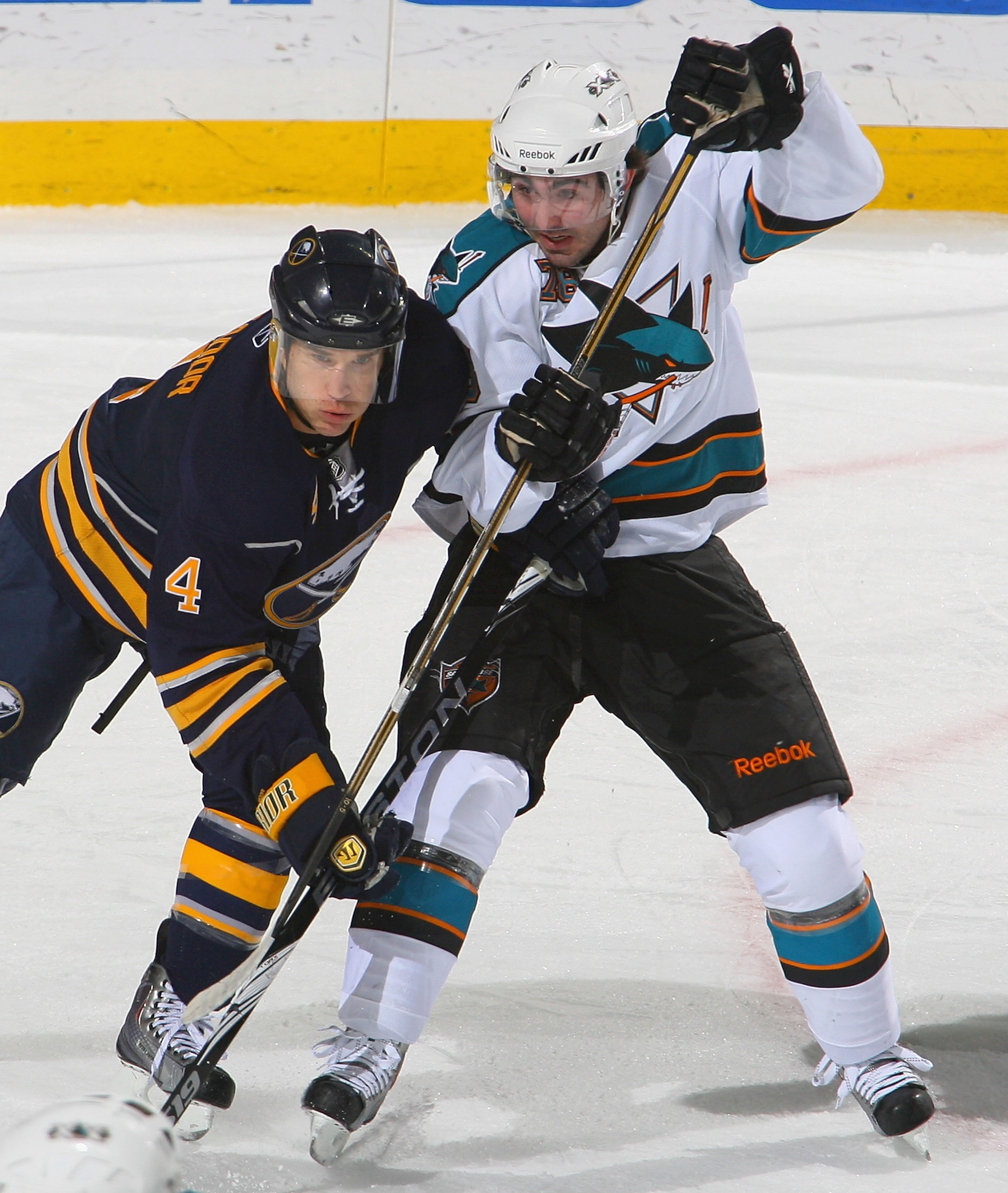 BUFFALO, NY - DECEMBER 09: Steve Montador #4  of the Buffalo Sabres skates against Benn Ferriero #78 of the San Jose Sharks at HSBC Arena on December 9, 2010 in Buffalo, New York. Buffalo won 6-3. (Photo by Rick Stewart/Getty Images)