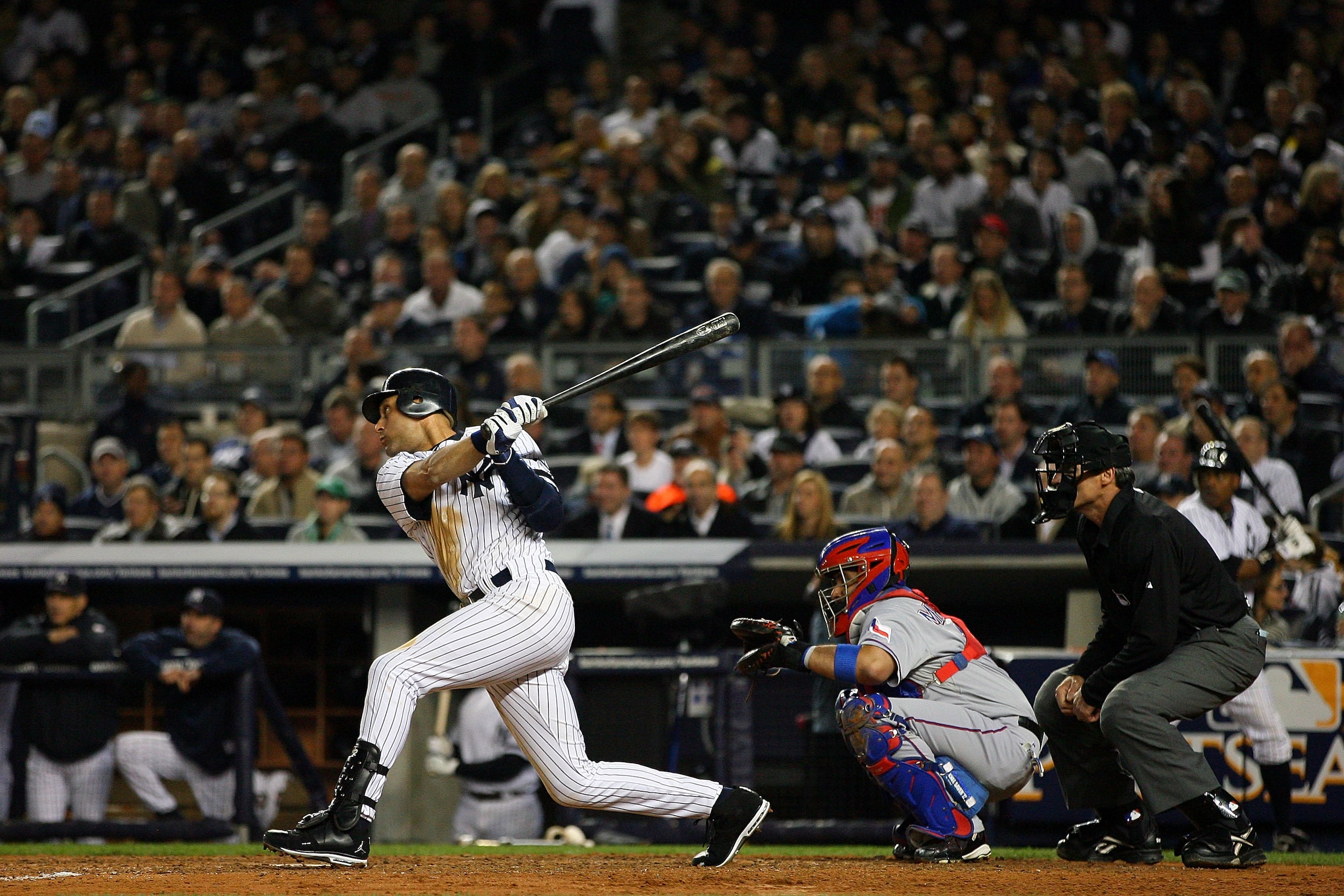 NEW YORK - OCTOBER 19:  Derek Jeter #2 of the New York Yankees hits a double in the fifth inning against the Texas Rangers in Game Four of the ALCS during the 2010 MLB Playoffs at Yankee Stadium on October 19, 2010 in the Bronx borough of New York City.