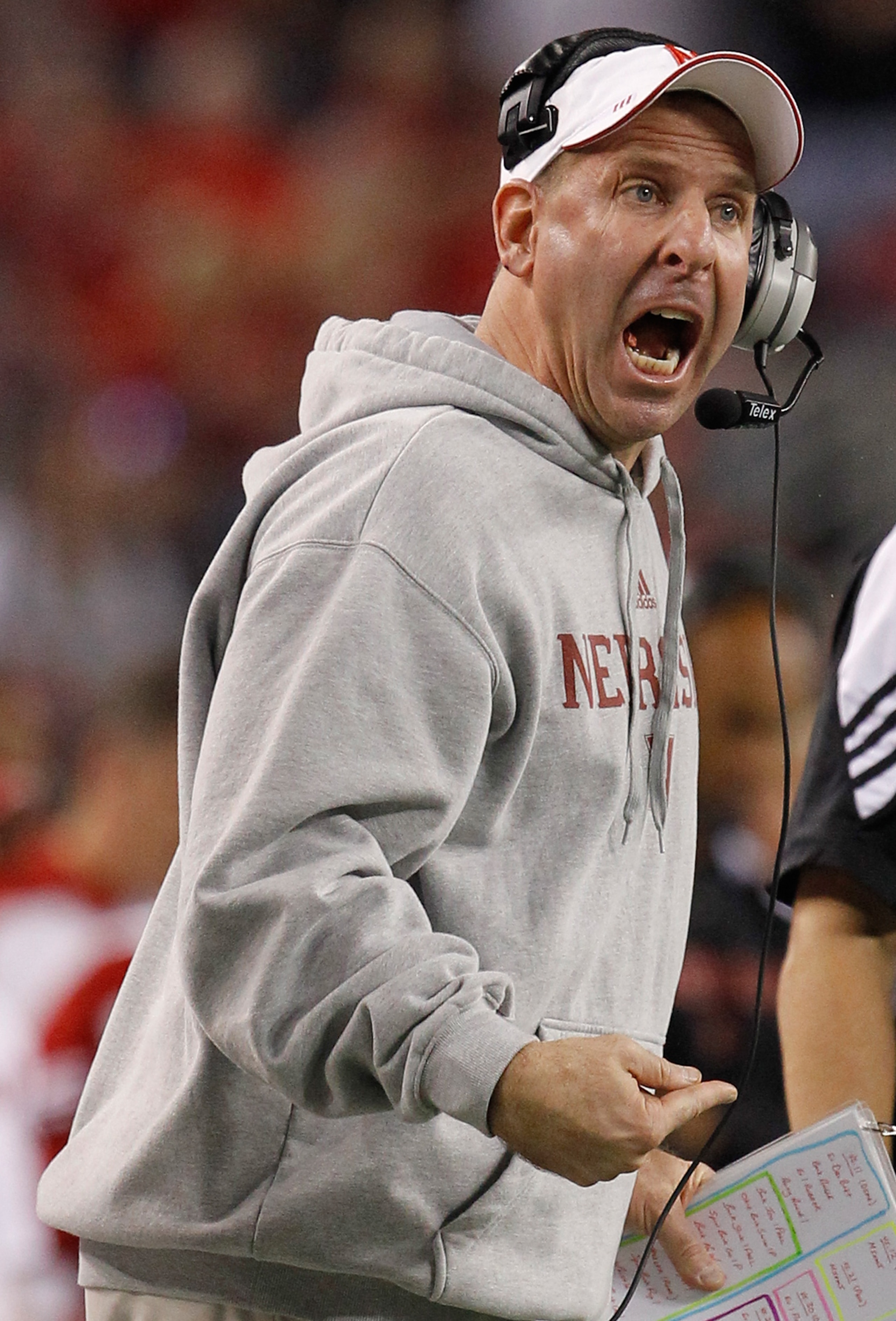 ARLINGTON, TX - DECEMBER 04:  Head coach Bo Pelini of the Nebraska Cornhuskers leads his team against the Oklahoma Sooners at Cowboys Stadium on December 4, 2010 in Arlington, Texas. The Sooners beat the Cornhuskers 23-20.  (Photo by Tom Pennington/Getty 