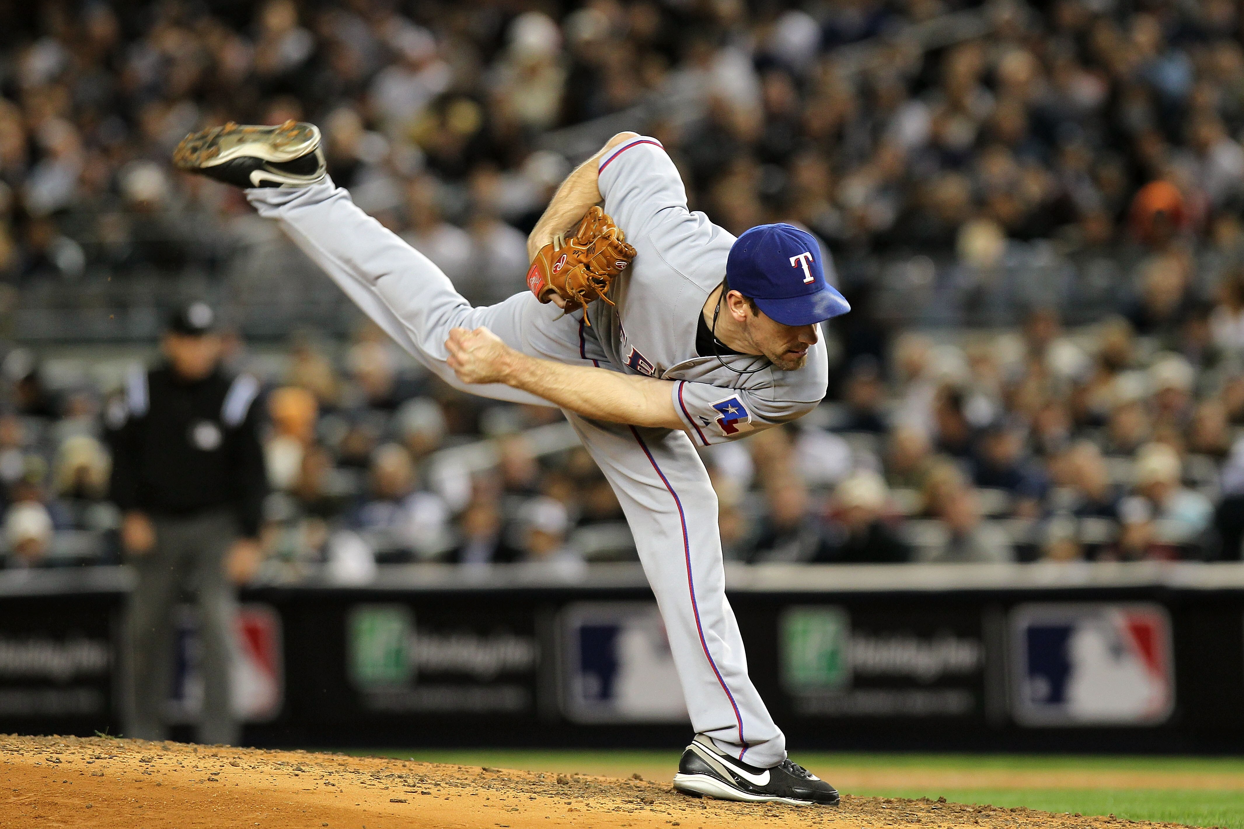 NEW YORK - OCTOBER 18:  Cliff Lee #33 of the Texas Rangers pitches against the New York Yankees  in Game Three of the ALCS during the 2010 MLB Playoffs at Yankee Stadium on October 18, 2010 in New York, New York.  (Photo by Nick Laham/Getty Images)