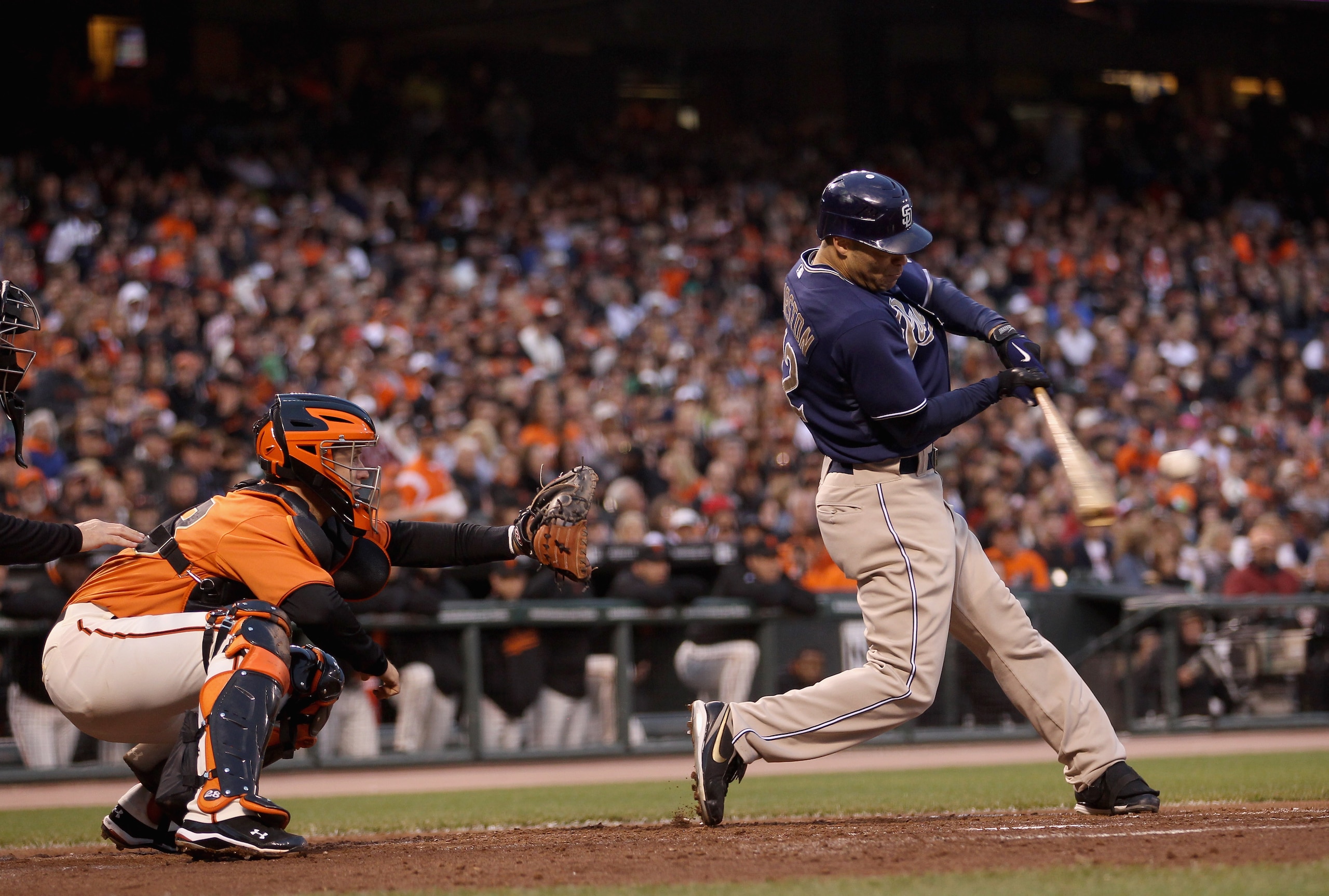 SAN FRANCISCO - AUGUST 13:  Scott Hairston #12 of the San Diego Padres hits a sac-fly that scored Chase Headley to tie the game 2-2 in the second inning of their game against the San Francisco Giants at AT&T Park on August 13, 2010 in San Francisco, Calif