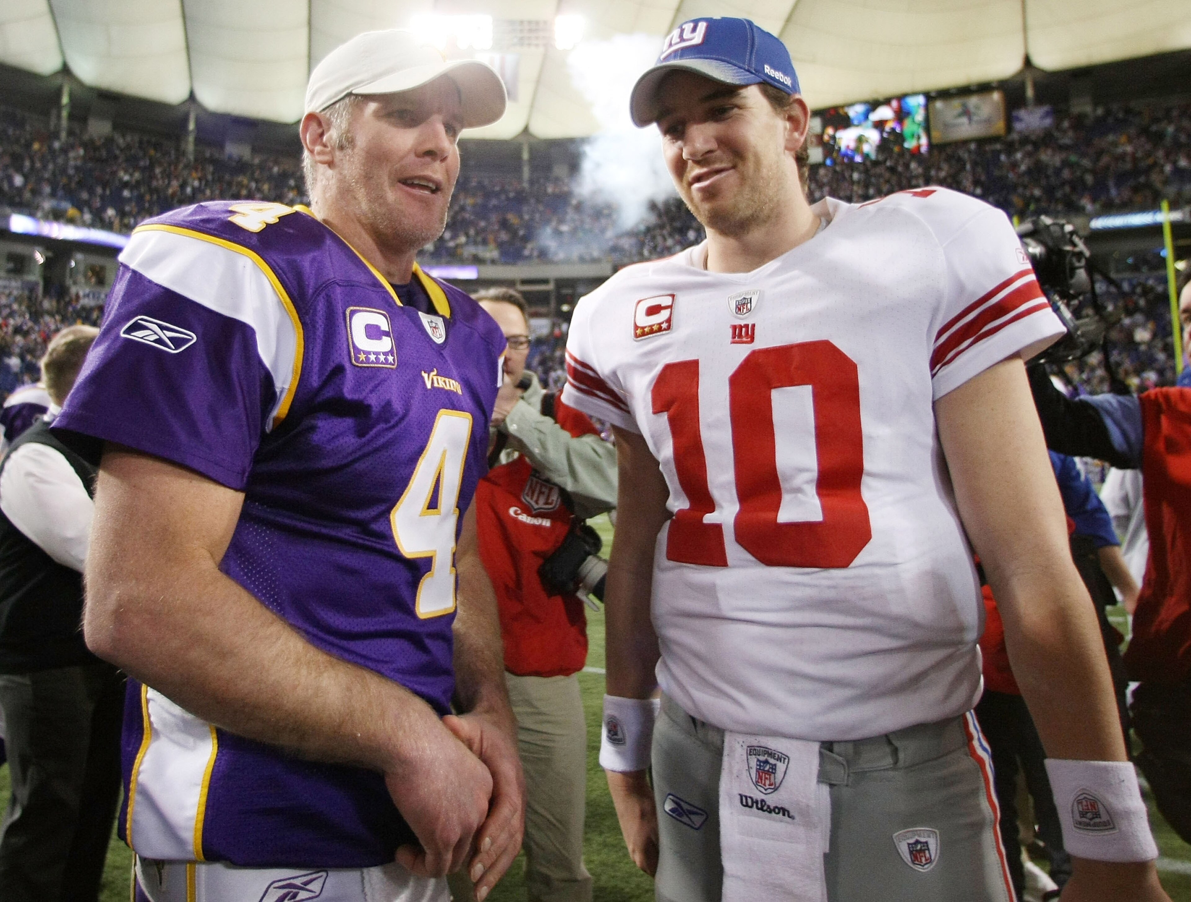 MINNEAPOLIS - JANUARY 03:  Brett Favre #4 of the Minnesota Vikings and Eli Manning #10 of the New York Giants talk after the game on January 3, 2010 at Hubert H. Humphrey Metrodome in Minneapolis, Minnesota. The Vikings defeated the Giants 44-7.  (Photo b
