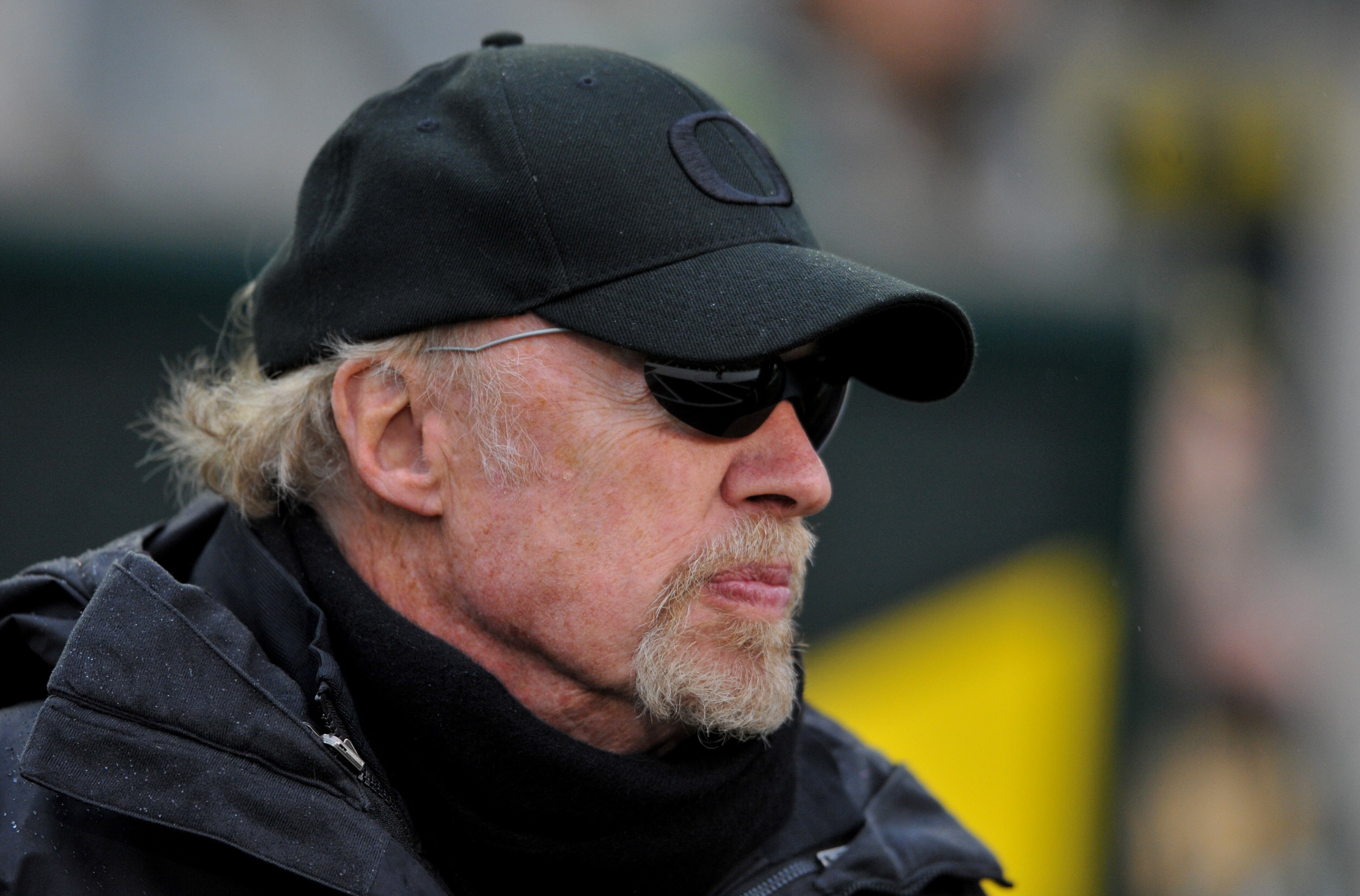 EUGENE, OR - NOVEMBER 26: Co-founder and Chairman of Nike, Phil Knight, looks on as the Oregon Ducks warm up before the game against the Arizona Wildcats at Autzen Stadium on November 26, 2010 in Eugene, Oregon. The Ducks won the game 48-29. (Photo by Ste