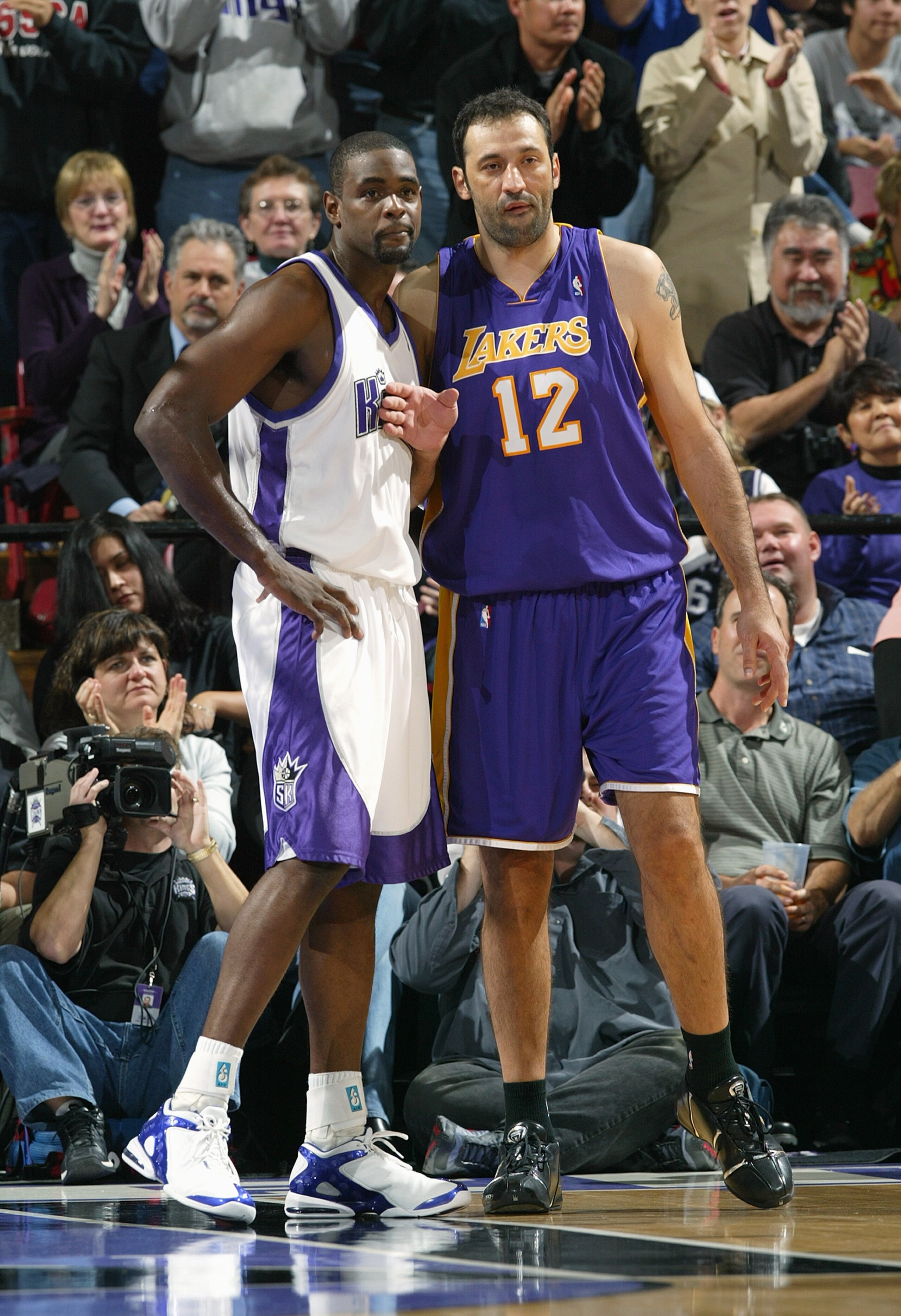 SACRAMENTO, CA - DECEMBER 16:  Chris Webber #4 of the Sacramento Kings and Vlade Divac #12 of the Los Angeles Lakers vie for position during their game on December 16, 2004 at Arco Arena  in Sacramento, California. The Lakers won 115-99. NOTE TO USER: Use