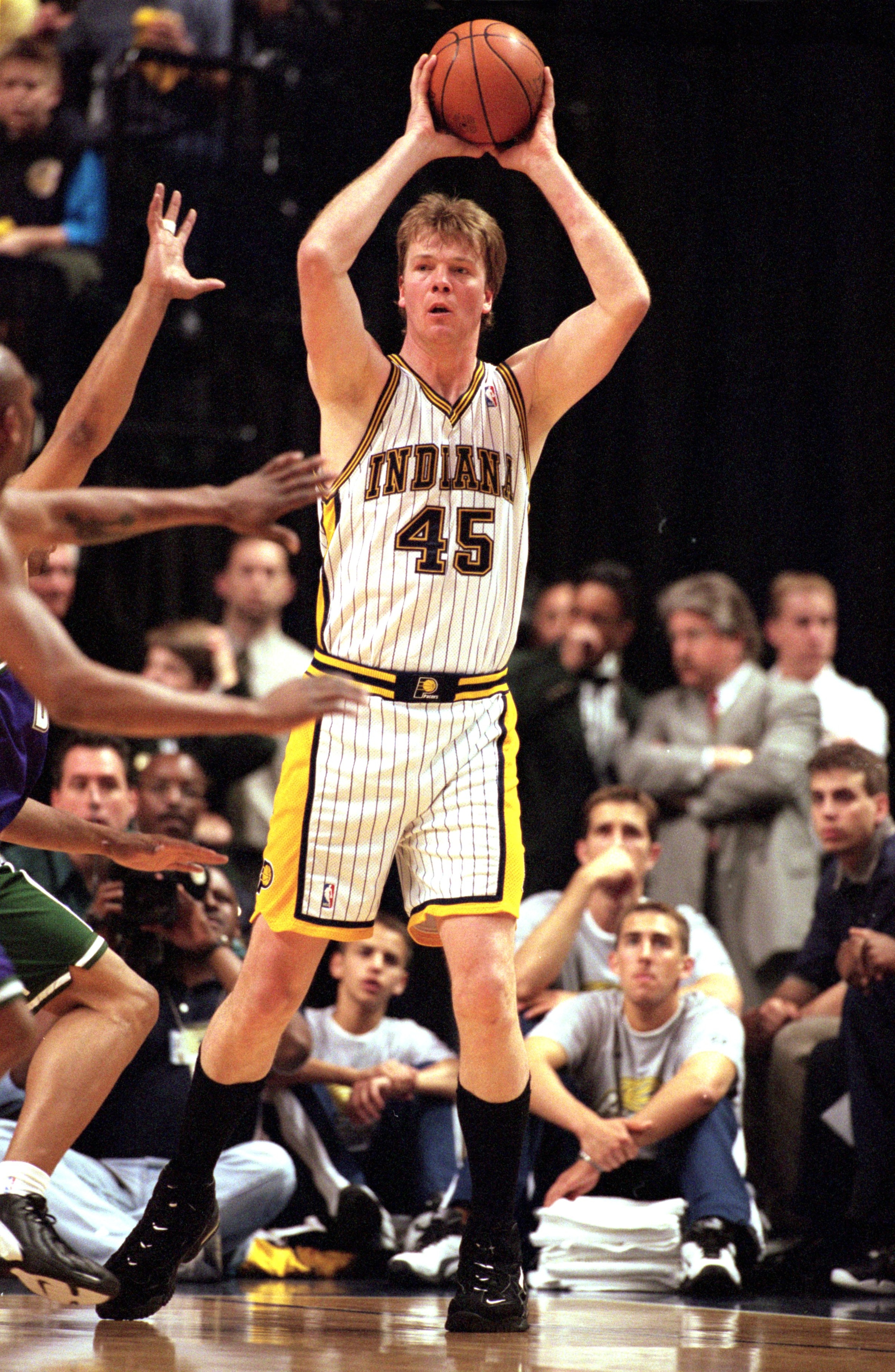 4 May 2000:  Rik Smits #45 of the Indiana Pacers puts the ball in play during the NBA Eastern Conference Playoffs Round One Game against the Milwaukee Bucks at the Conseco Field House In Indianapolis, Indiana. The Pacers defeated the Bucks 96-95.  NOTE TO