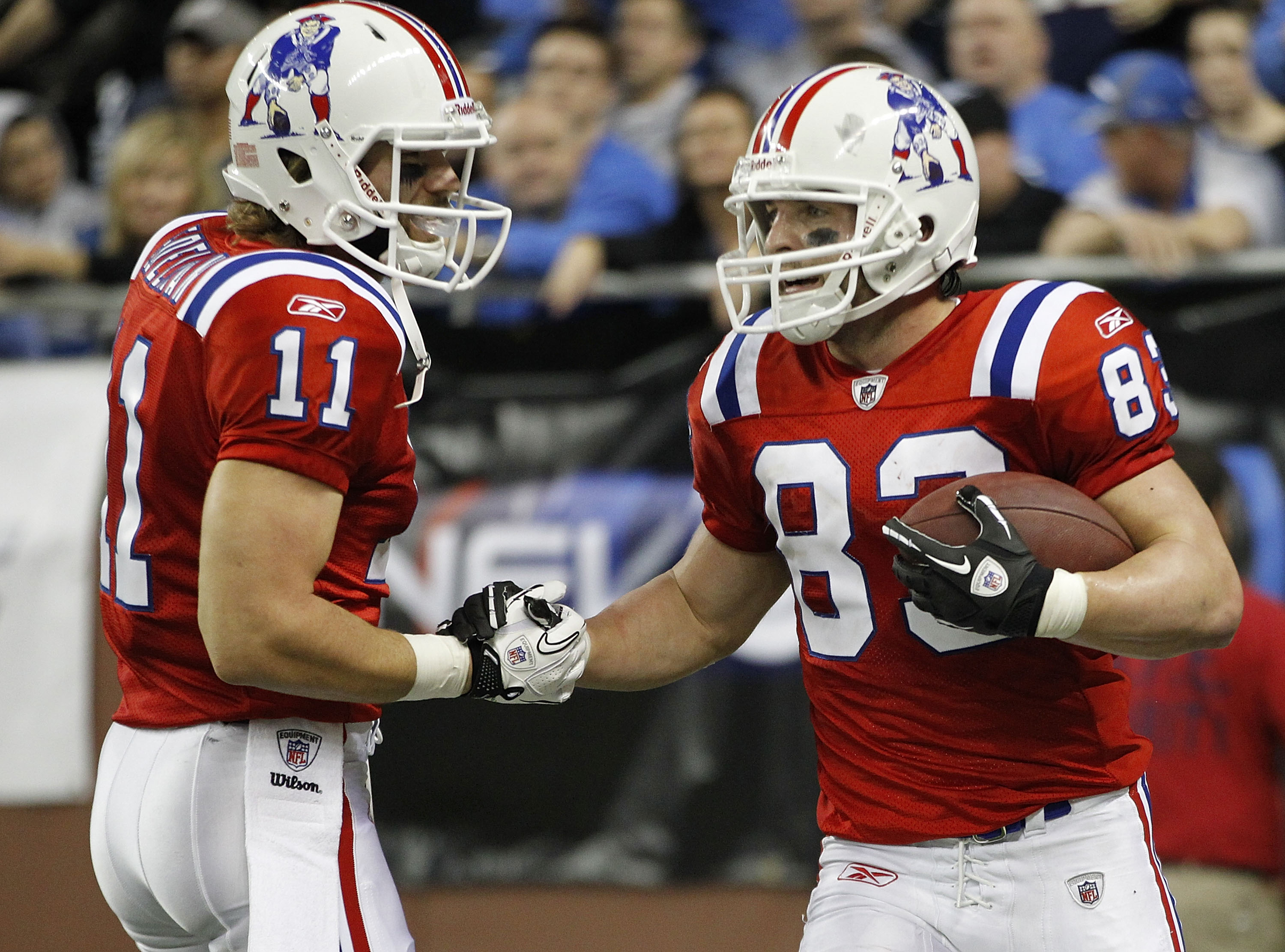 DETROIT - NOVEMBER 25: Julian Edelman #11 of the New England Patriots congratulates teammate Wes Welker #83 after a fourth quarter touchdown during the game against the Detroit Lions at Ford Field on November 25, 2010 in Detroit, Michigan. New England def