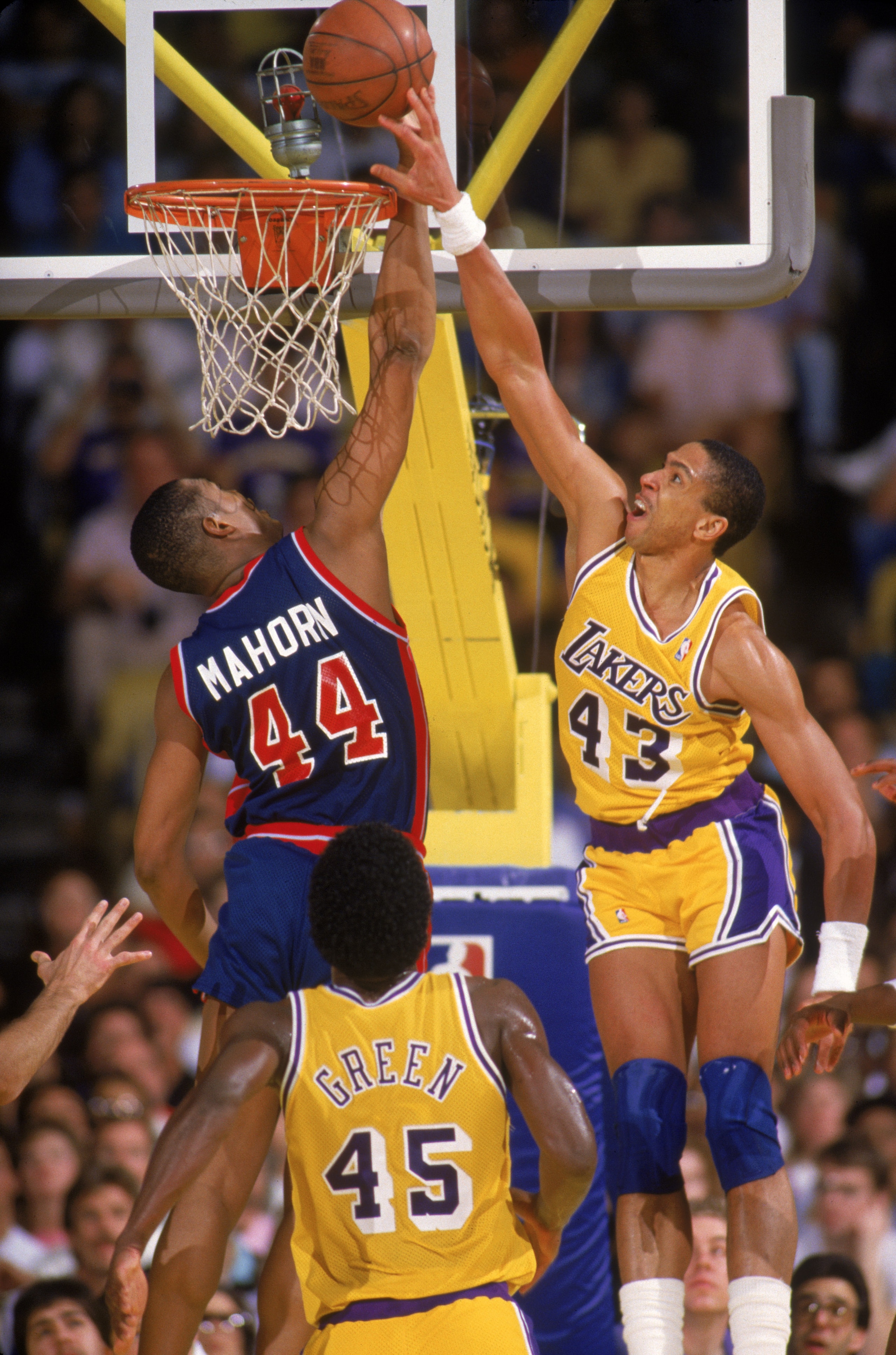 LOS ANGELES - 1987:  Mychal Thompson #43 of the Los Angeles Lakers battles for a rebound with Rick Mahorn #44 of the Detroit Pistons during an NBA game at the Great Western Forum in Los Angeles, California in 1987. (Photo by Rick Stewart/Getty Images)