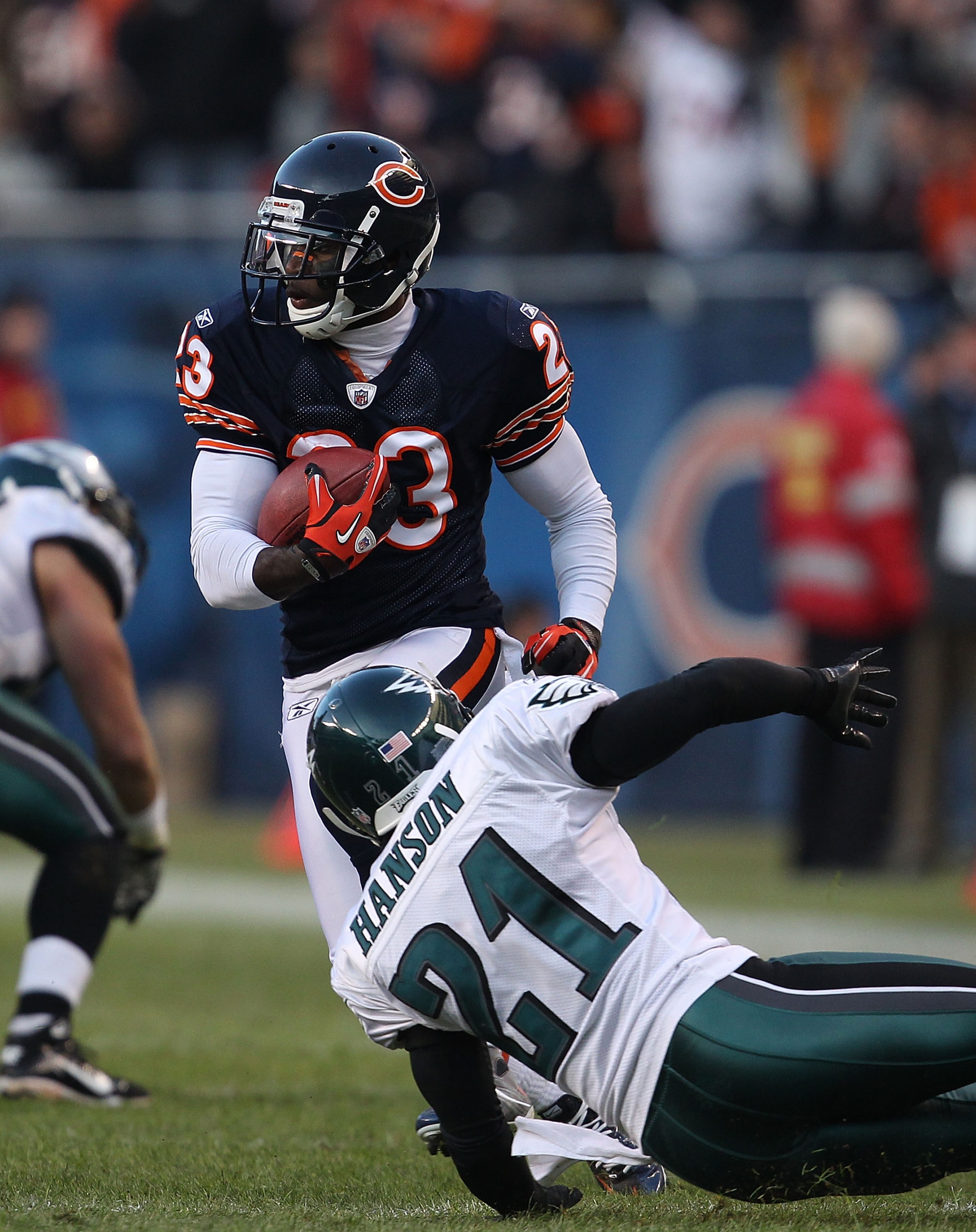 CHICAGO - NOVEMBER 28: Devin Hester #23 of the Chicago Bears moves around Joselio Hanson #21 of the Philadelphia Eagles during a first down run at Soldier Field on November 28, 2010 in Chicago, Illinois. The Bears defeated the Eagles 31-26. (Photo by Jona
