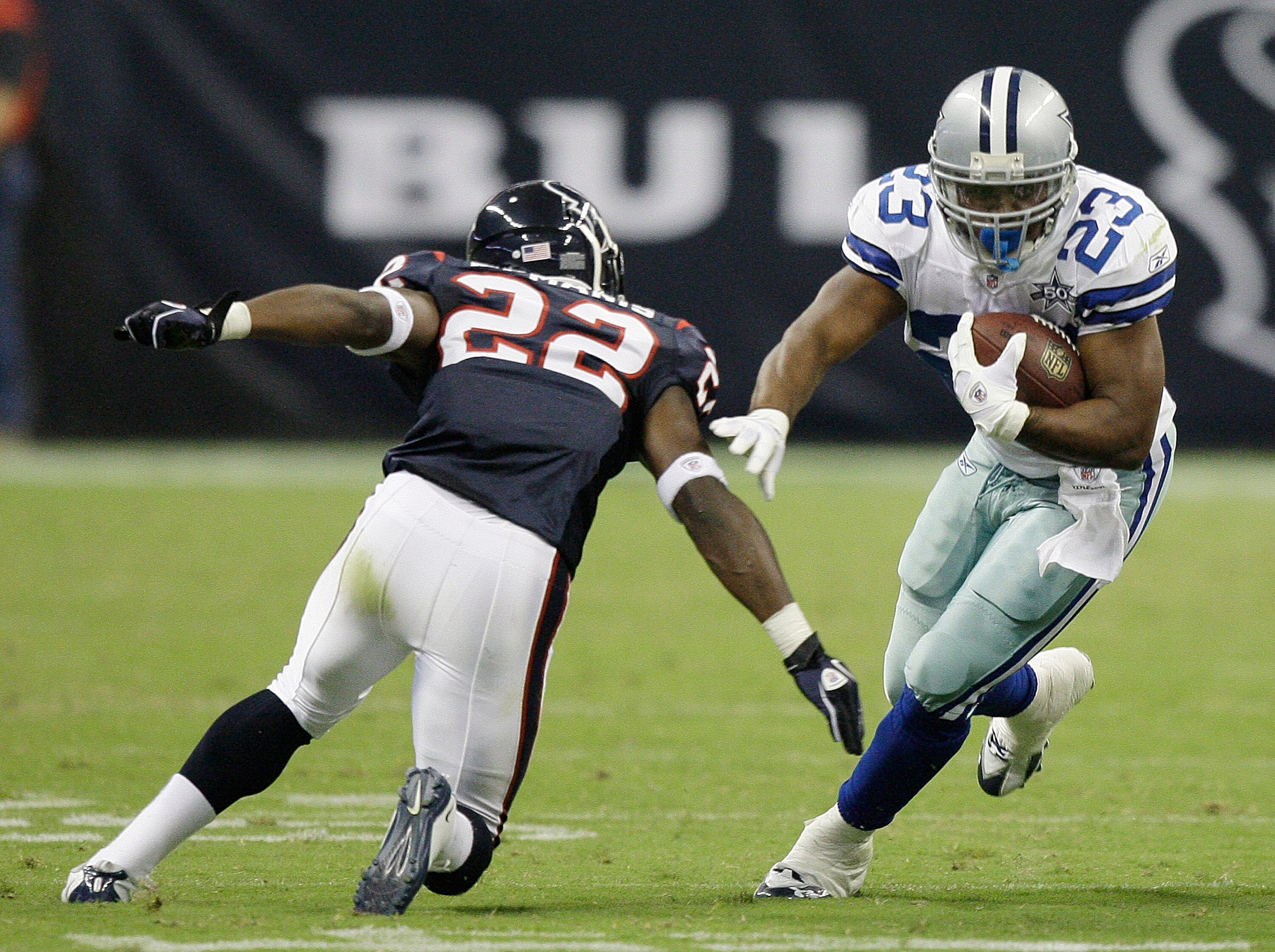HOUSTON - AUGUST 28:  Running back Tashard Choice #23 of the Dallas Cowboys cuts back on cornerback Sherrick McManis #22 of the Houston Texans at Reliant Stadium on August 28, 2010 in Houston, Texas.  (Photo by Bob Levey/Getty Images)