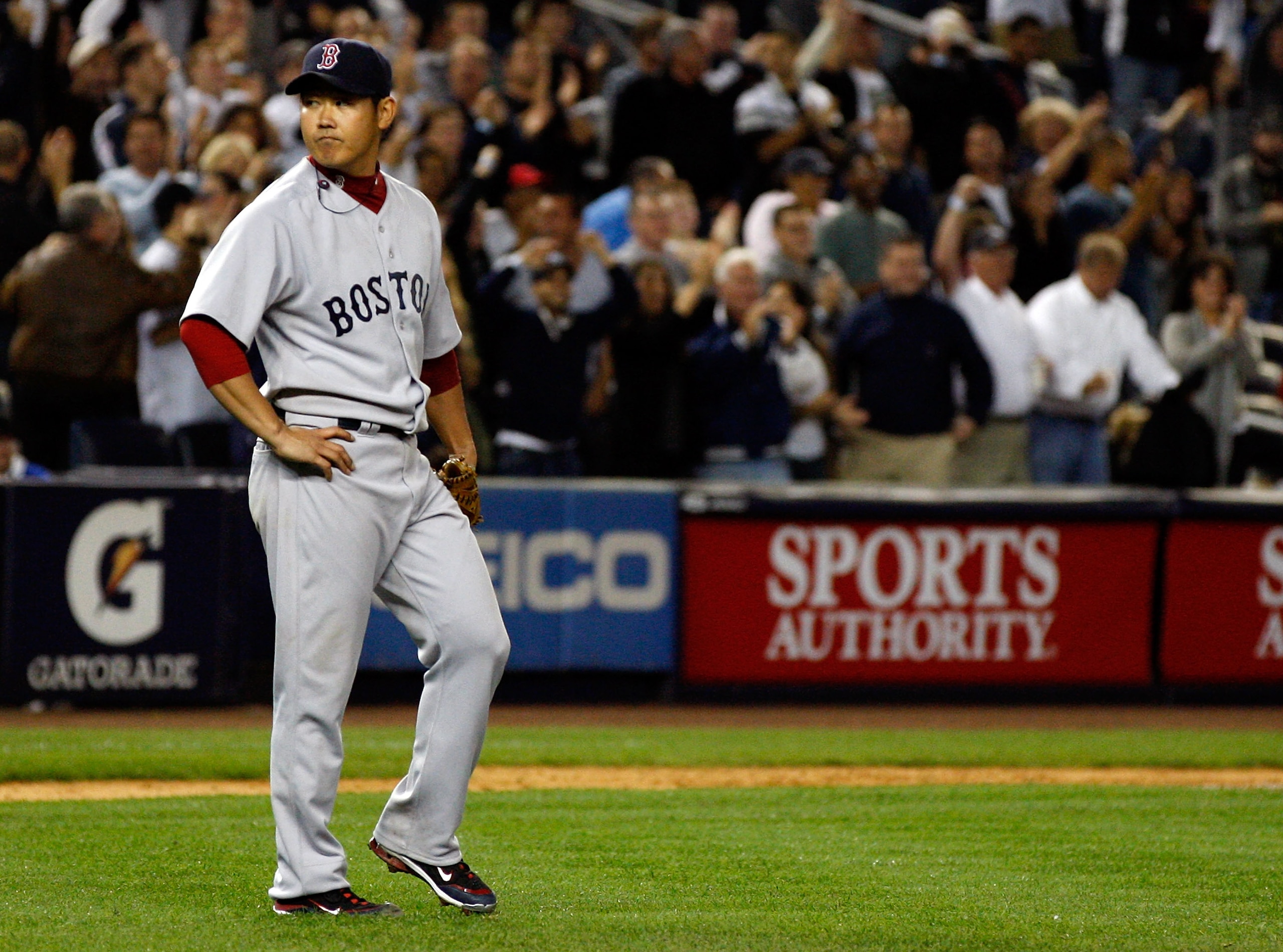 NEW YORK - SEPTEMBER 26:  Daisuke Matsuzaka #18 of the Boston Red Sox looks on after giving up a two run homerun in the seventh-inning to Alex Rodriguez #13 (not shown) of the New York Yankees on September 26, 2010 at Yankee Stadium in the Bronx borough o