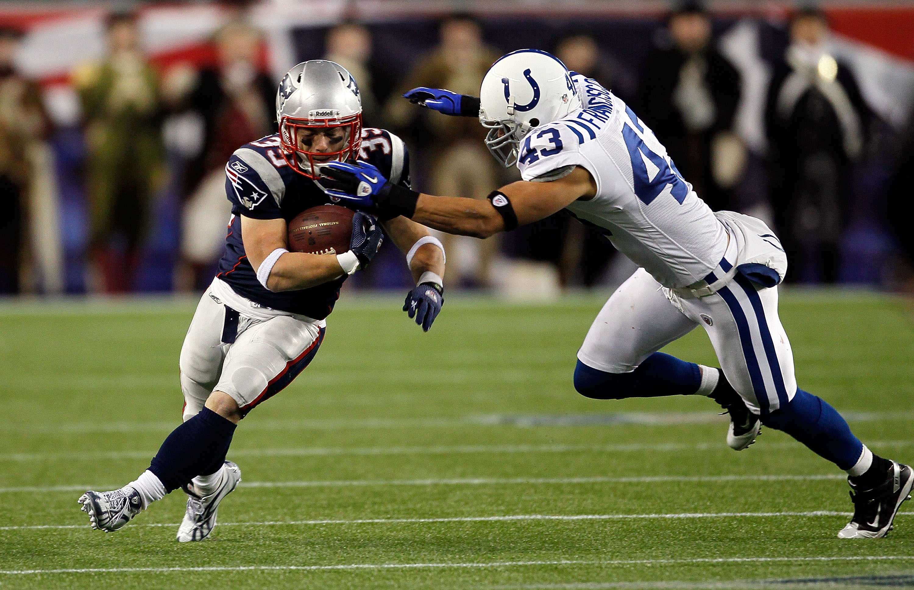 FOXBORO, MA - NOVEMBER 21:  Danny Woodhead #39 of the New England Patriots gains yards despite the defense of Aaron Francisco #43 of the Indianapolis Colts at Gillette Stadium on November 21, 2010 in Foxboro, Massachusetts. The Patriots won 31-28. (Photo