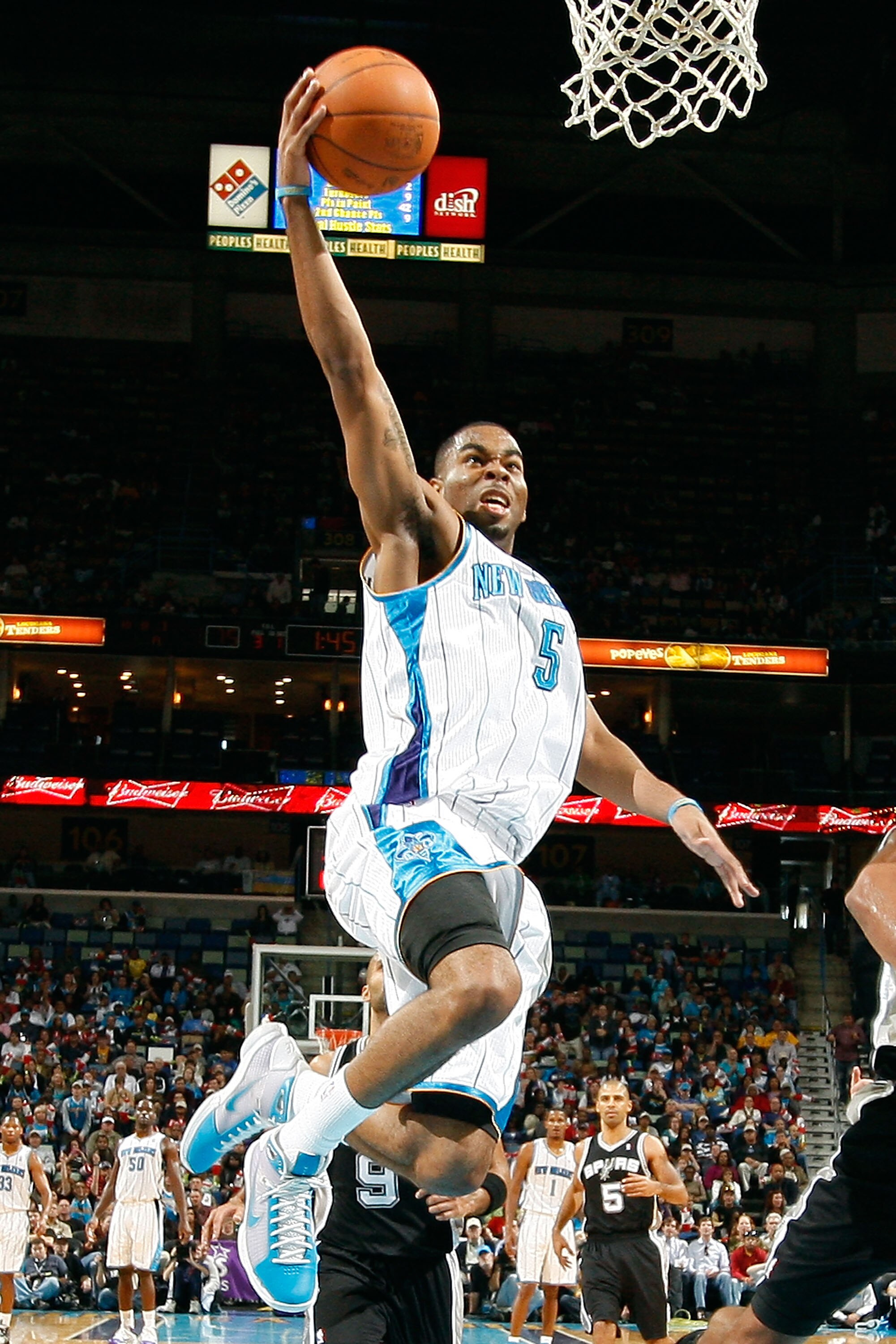 NEW ORLEANS - NOVEMBER 28:  Marcus Thornton #5 of the New Orleans Hornets makes a layup during the game against the San Antonio Spurs at the New Orleans Arena on November 28, 2010 in New Orleans, Louisiana.  NOTE TO USER: User expressly acknowledges and a