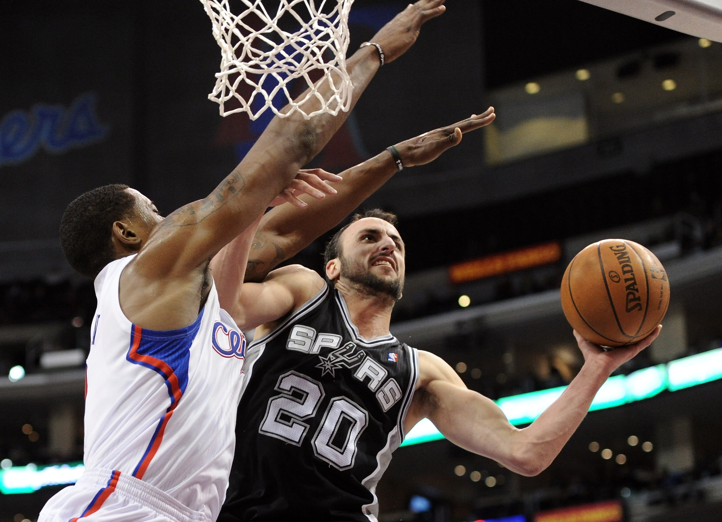 LOS ANGELES, CA - DECEMBER 01:  Manu Ginobili #20 of the San Antonio Spurs attempts a shot over the defense of DeAndre Jordan #9 of the Los Angeles Clippers during a 90-85 Clipper win at the Staples Center on December 1, 2010 in Los Angeles, California.