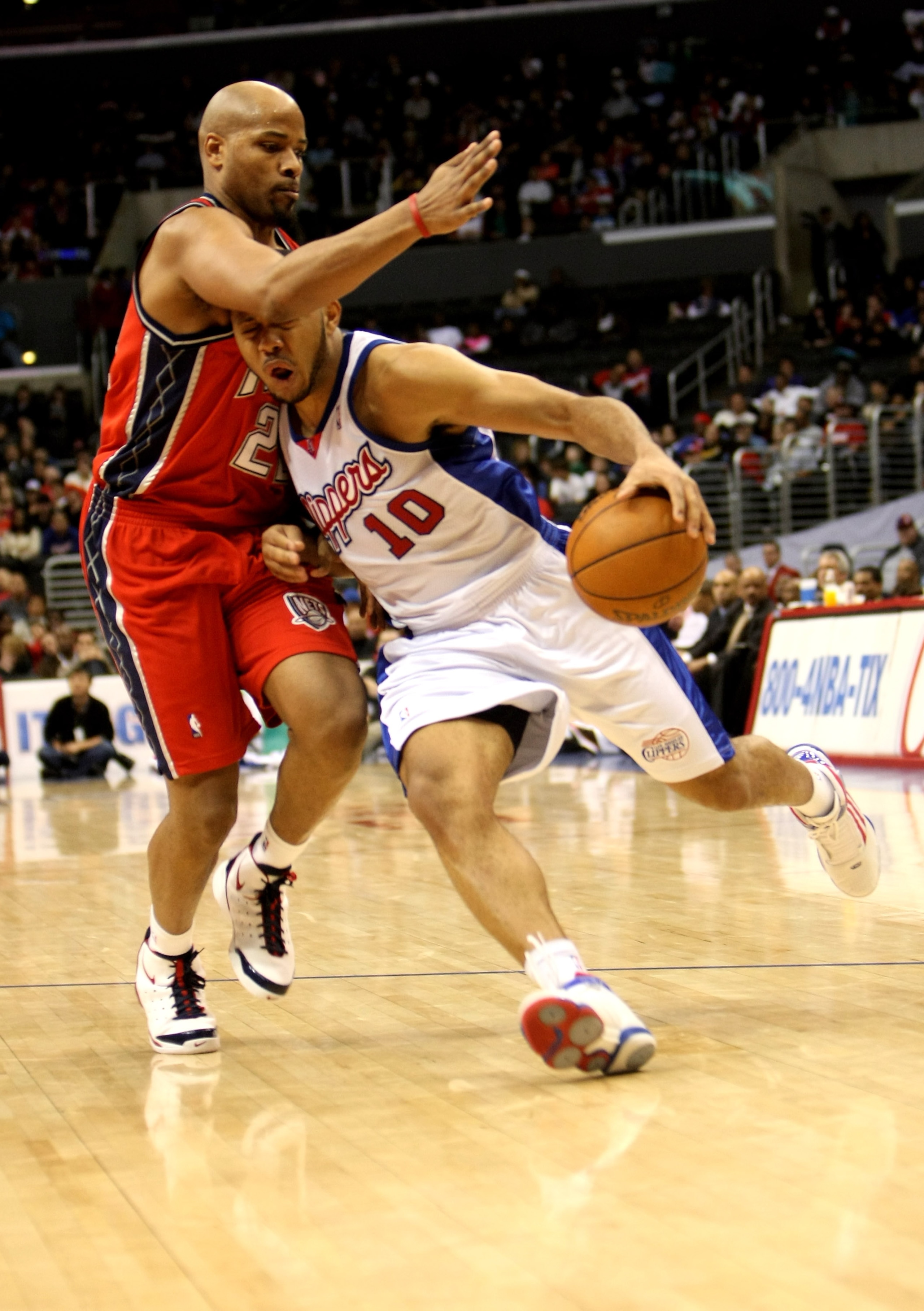 LOS ANGELES - JANUARY 18: Eric Gordon #10 of the Los Angeles Clippers runs into Jarvis Hayes s#22 of the New Jersey Nets as he drives on January 18, 2010 at Staples Center in Los Angeles, California. The Clippers won 106-95.  NOTE TO USER: User expressly