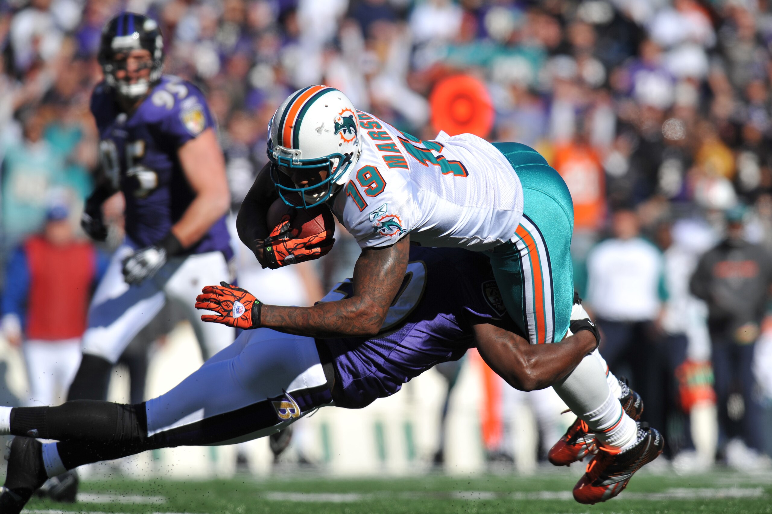 BALTIMORE, MD - NOVEMBER 7:  Brandon Marshall #19 of the Miami Dolphins runs the ball against the Baltimore Ravens at M&T Bank Stadium on November 7, 2010 in Baltimore, Maryland. The Ravens defeated the Dolphins 26-10. (Photo by Larry French/Getty Images)