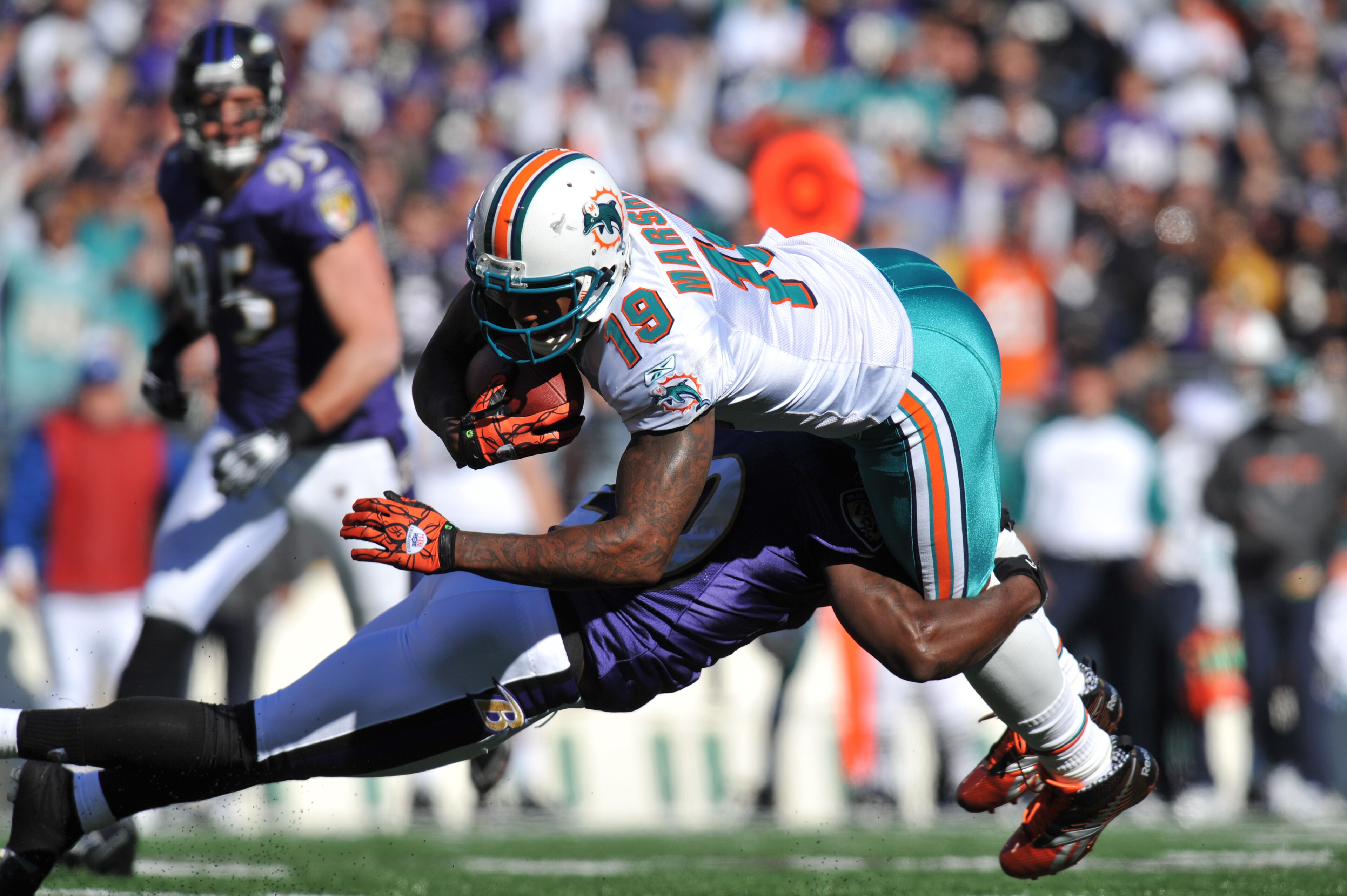 BALTIMORE, MD - NOVEMBER 7:  Brandon Marshall #19 of the Miami Dolphins runs the ball against the Baltimore Ravens at M&T Bank Stadium on November 7, 2010 in Baltimore, Maryland. The Ravens defeated the Dolphins 26-10. (Photo by Larry French/Getty Images)