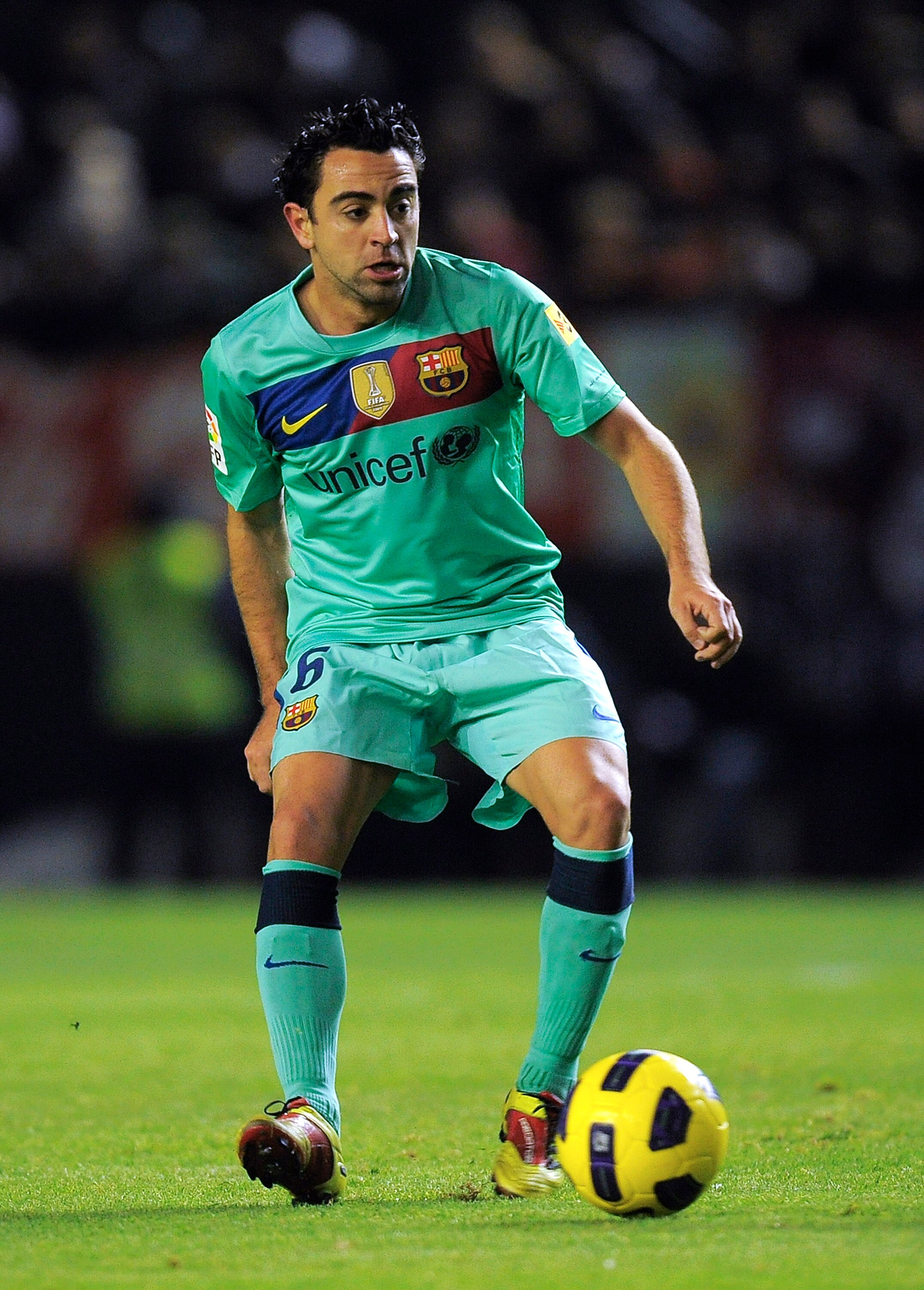 PAMPLONA, SPAIN - DECEMBER 04:  Xavi Hernandez of FC Barcelona goes for the ball during the La Liga match between CA Osasuna and Barcelona at Estadio Reyno de Navarra on December 4, 2010 in Pamplona, Spain. Barcelona won 0-3.  (Photo by David Ramos/Getty