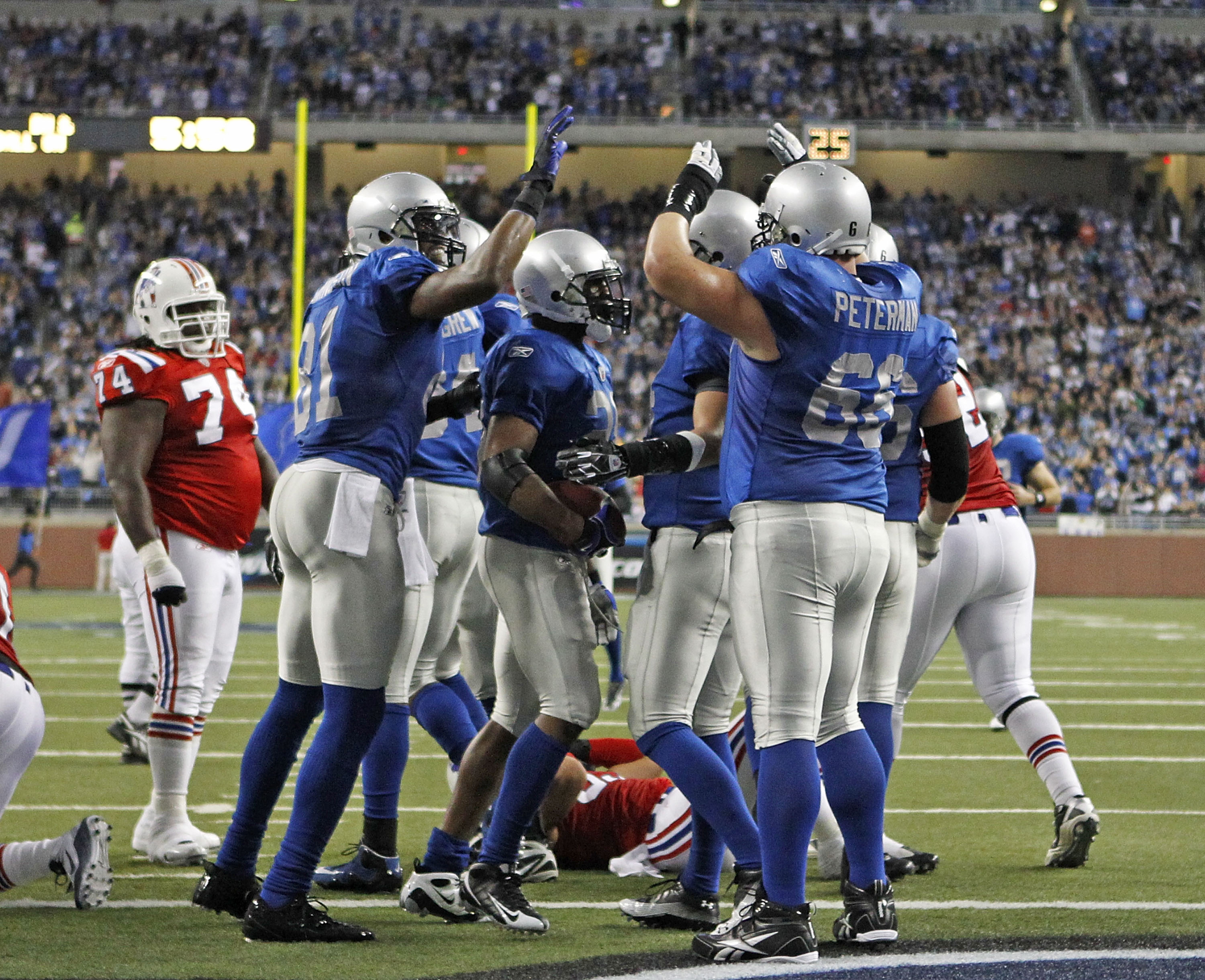 DETROIT - NOVEMBER 25:  Maurice Morris #28 of the Detroit Lions celebrates with teammates after scoring on a one yard run in the second quarter to give the Lions a 14-3 lead over the New England Patriots at Ford Field on November 25, 2010 in Detroit, Mich