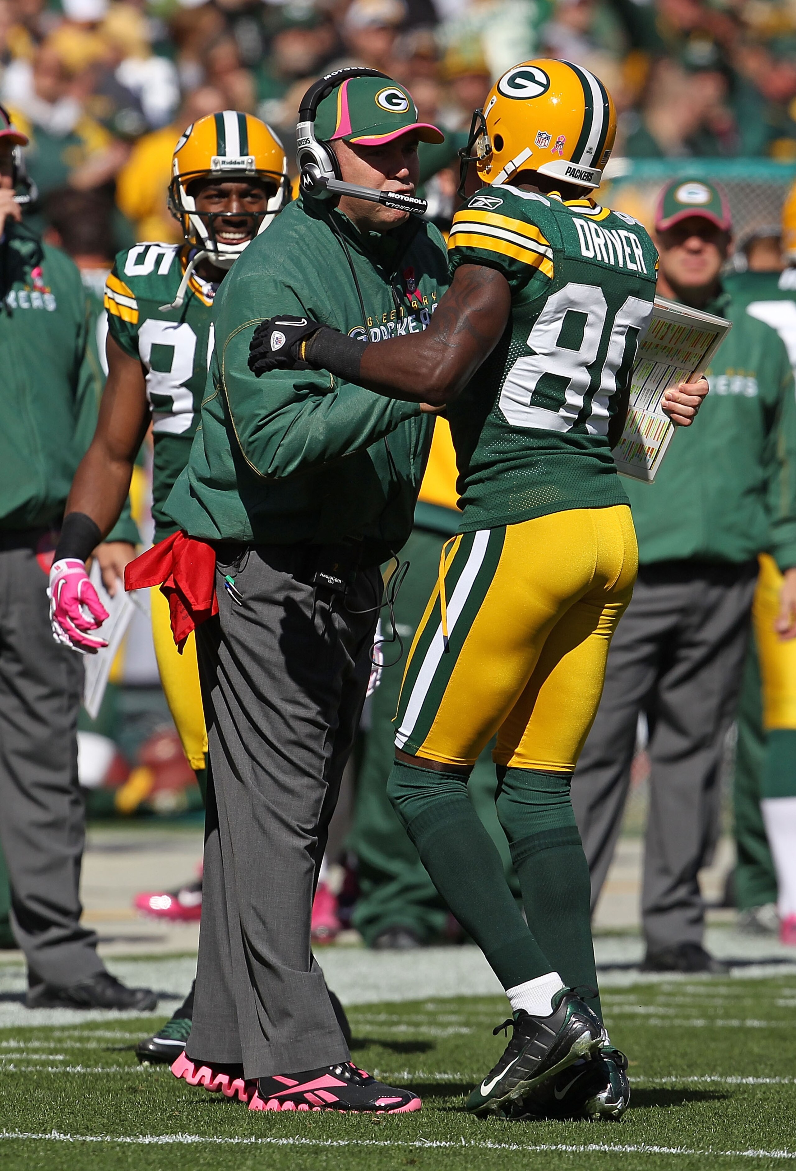 GREEN BAY, WI - OCTOBER 03: Head coach Mike McCarthy of the Green Bay Packers congratulates Donald Driver #80 after a touchdown against the Detroit Lions at Lambeau Field on October 3, 2010 in Green Bay, Wisconsin. The Packers defeated the Lions 28-26. (P