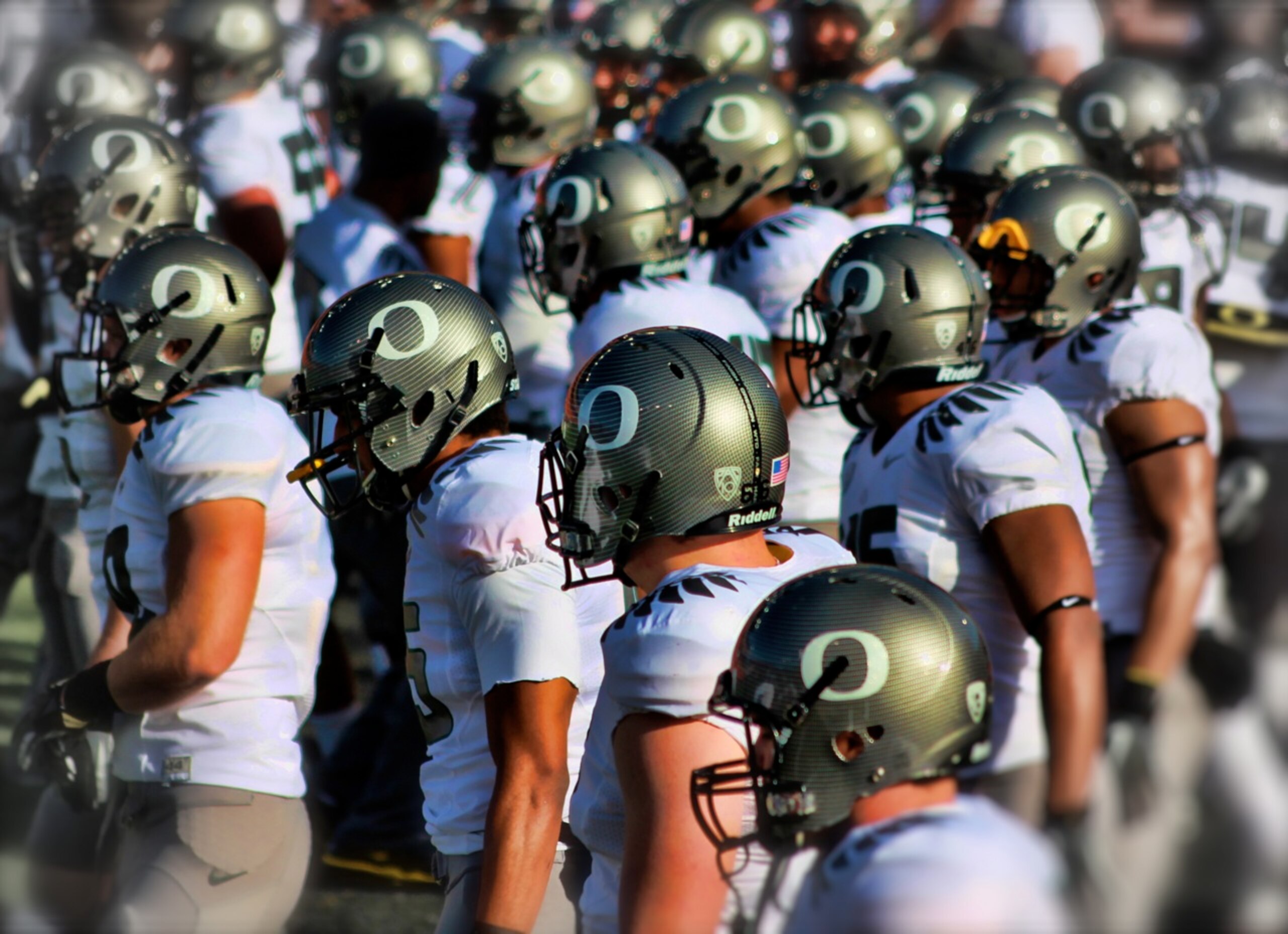 Photo of the Oregon Ducks taking the field by Joel Conrad Bechtolt