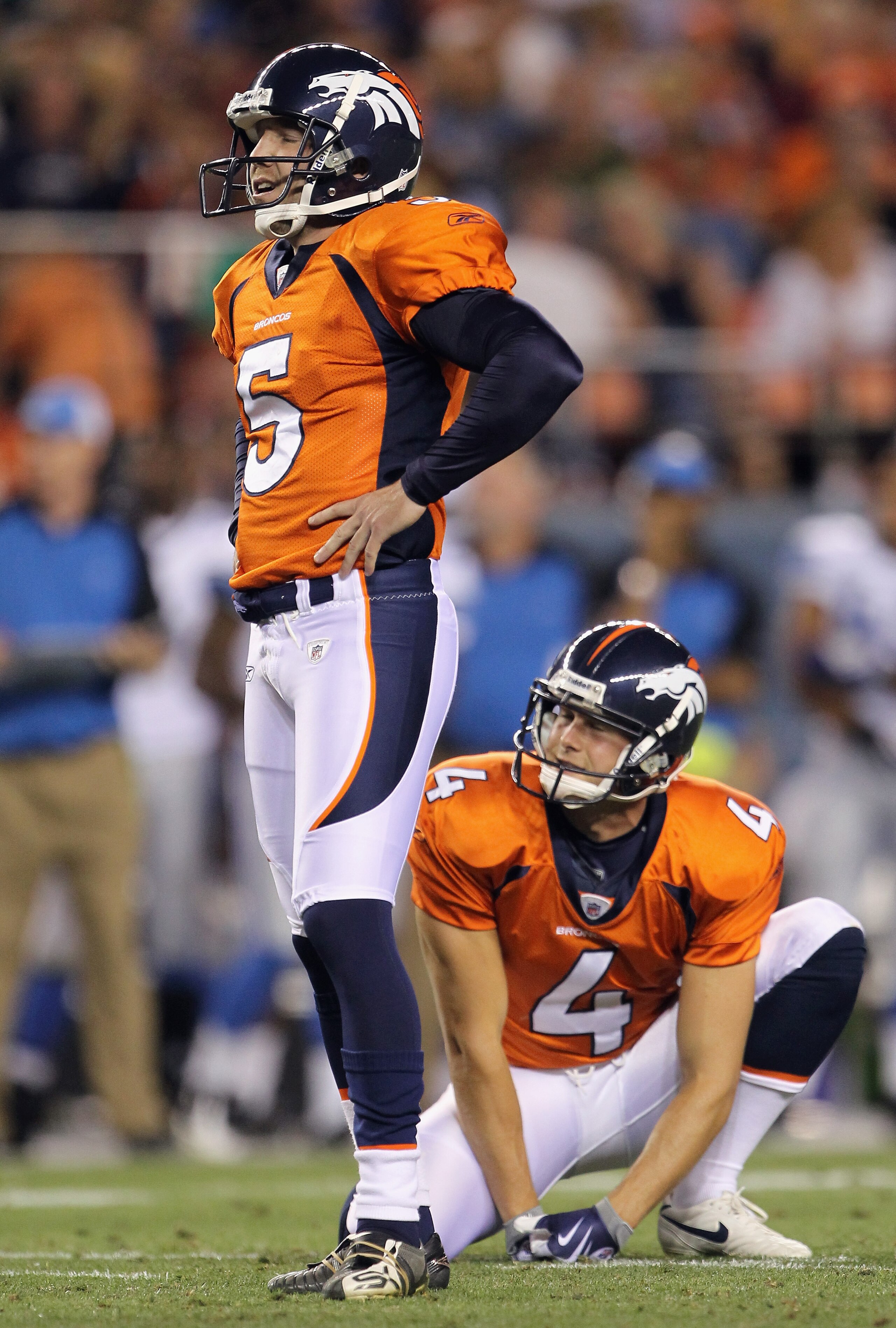 DENVER - AUGUST 21:  Place kicker Matt Prater #5 of the Denver Broncos watches along with holder Britton Colquitt #4 as his field goal attempt misses against the Detroit Lions during preseason NFL action at INVESCO Field at Mile High on August 21, 2010 in