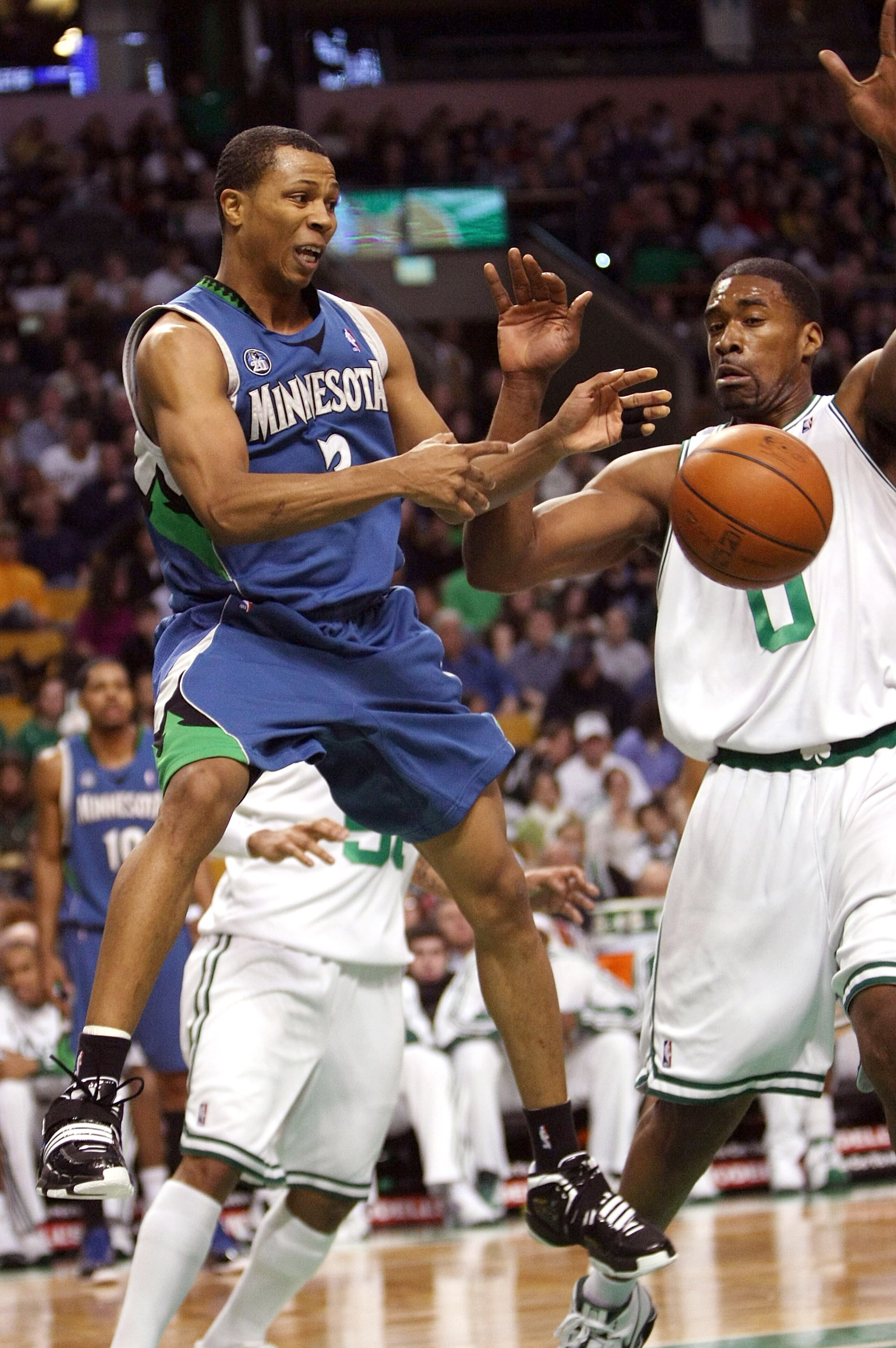 BOSTON - FEBRUARY 01:  Sebastian Telfair #3 of Minnesota Timberwolves passes the ball as Leon Powe #0 of the Boston Celtics defends on February 1, 2009 at TD Banknorth Garden in Boston, Massachusetts. NOTE TO USER: User expressly acknowledges and agrees t