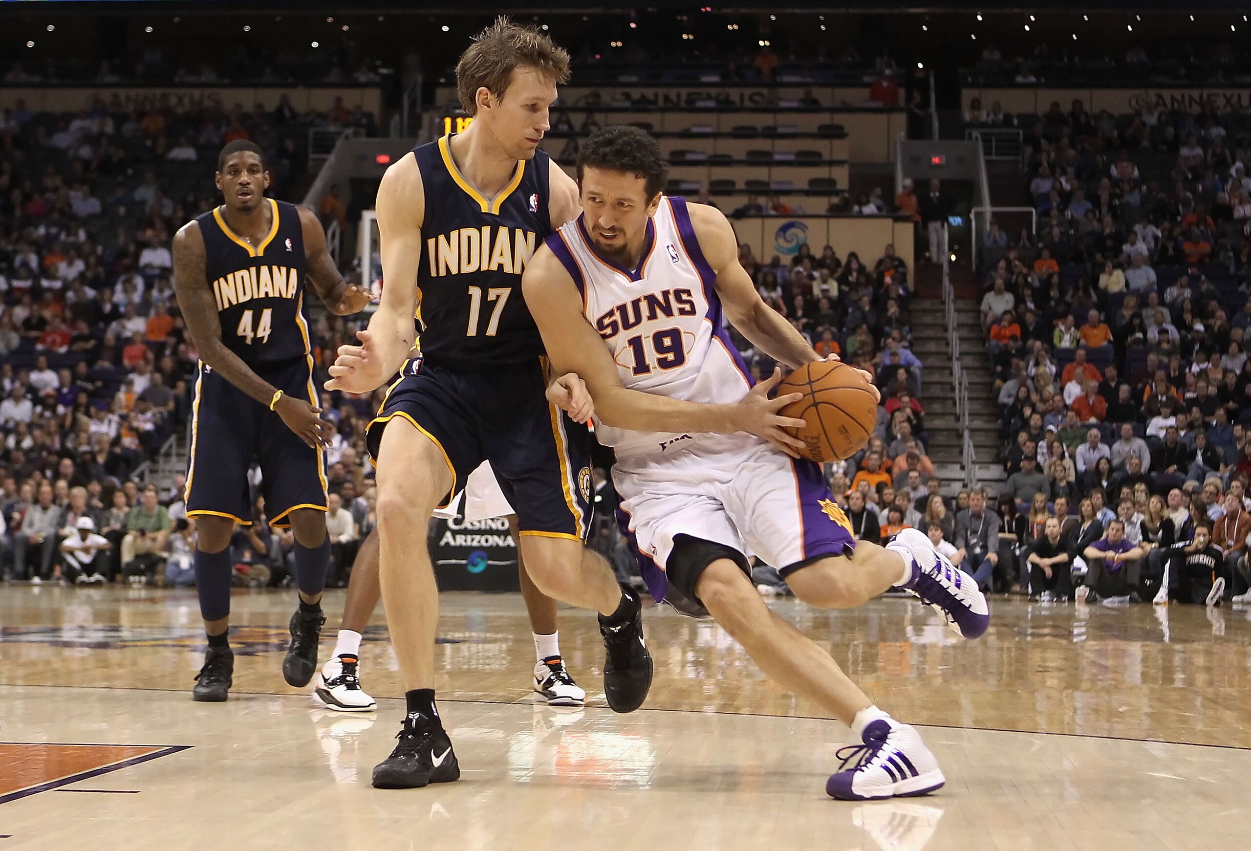 PHOENIX - DECEMBER 03:  Hedo Turkoglu #19 of the Phoenix Suns drives with the ball against Mike Dunleavy #17 of the Indiana Pacers during the NBA game at US Airways Center on December 3, 2010 in Phoenix, Arizona.  The Suns defeated the Pacers 105-97.  NOT