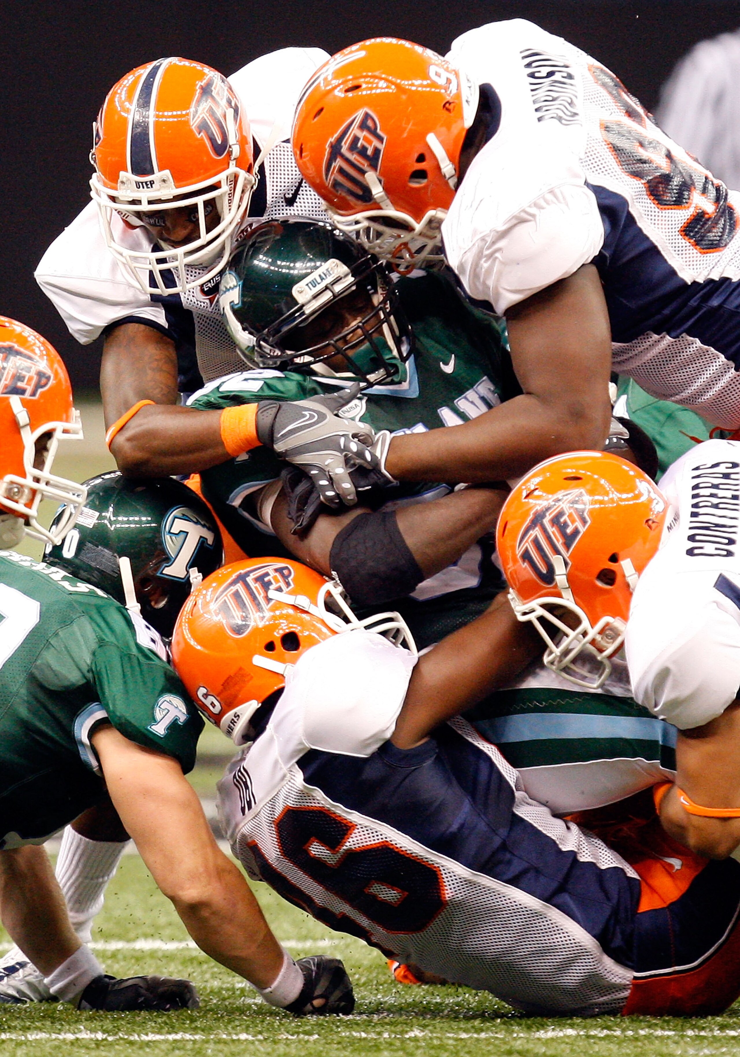 NEW ORLEANS - NOVEMBER 07:  Running back Andre Anderson #32 of the Tulane Green Wave is tackled by the UTEP Miners at Louisana Superdome on November 7, 2009 in New Orleans, Louisiana.  (Photo by Ronald Martinez/Getty Images)
