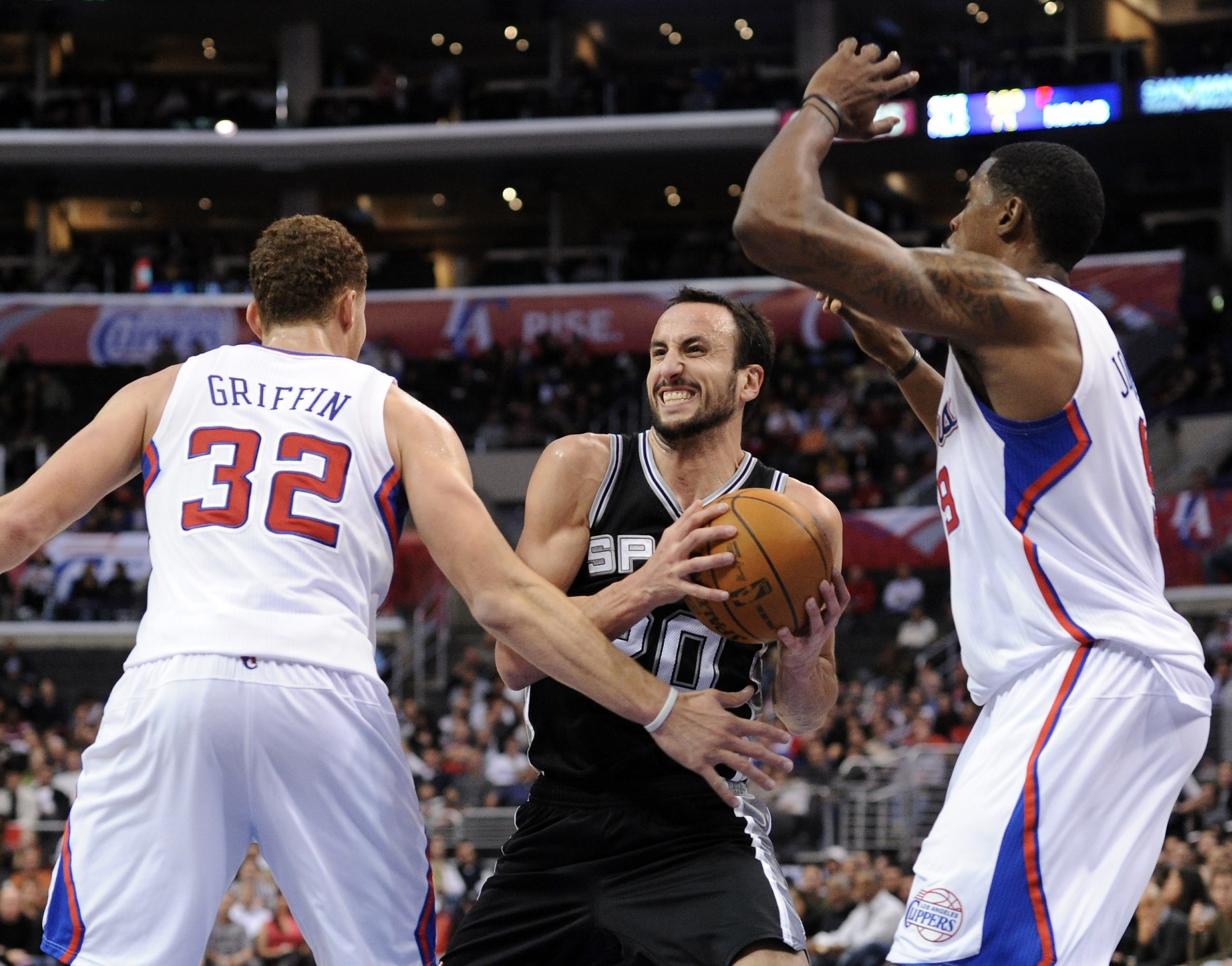 LOS ANGELES, CA - DECEMBER 01:  Manu Ginobili #20 of the San Antonio Spurs cuts between Blake Griffin #32 and DeAndre Jordan #9 of the Los Angeles Clippers during the game at the Staples Center on December 1, 2010 in Los Angeles, California.  NOTE TO USER