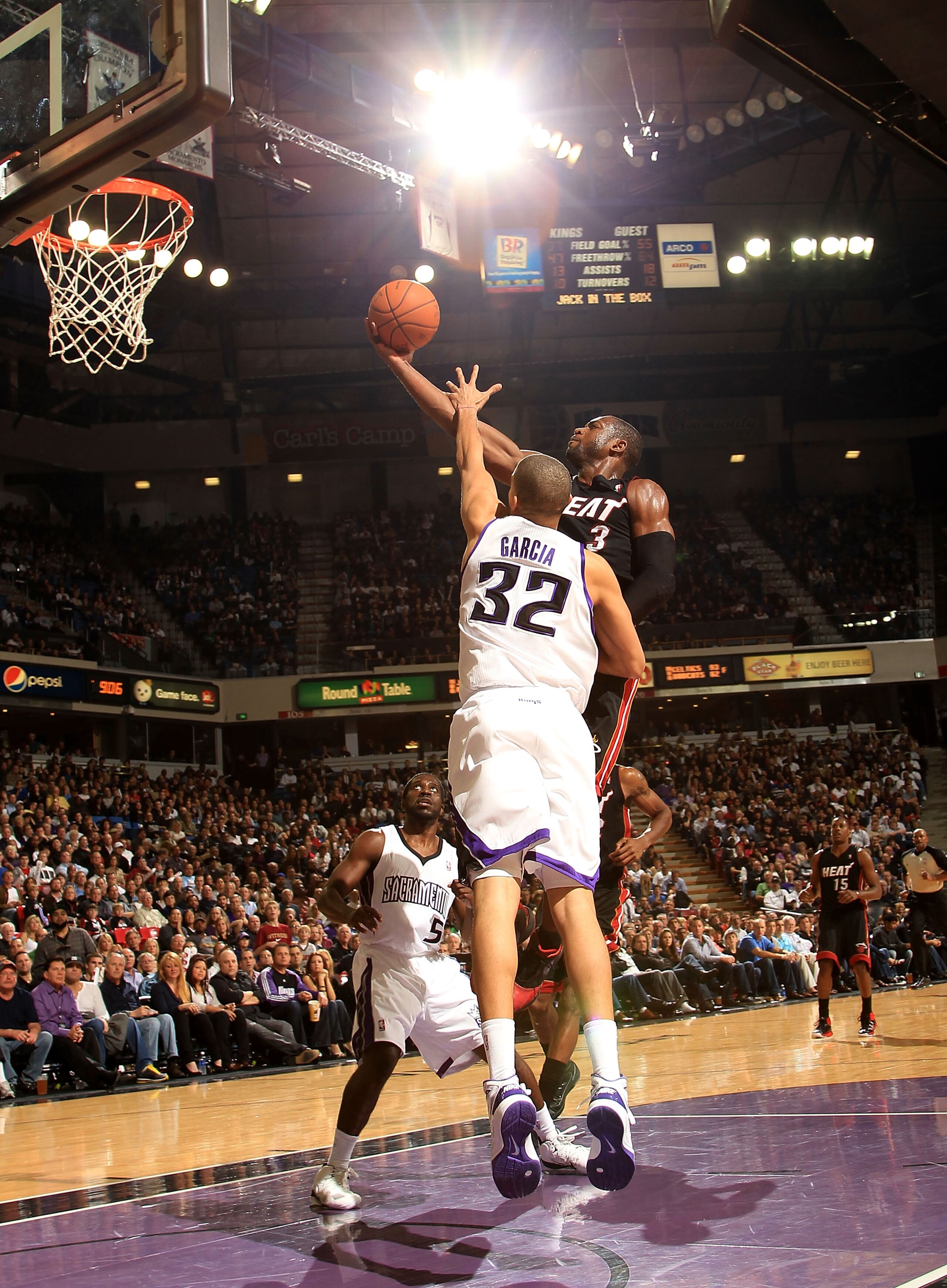 SACRAMENTO, CA - DECEMBER 11:  Dwayne Wade #3 of the Miami Heat drives to the basket against the Sacramento Kings at ARCO Arena on December 11, 2010 in Sacramento, California.  NOTE TO USER: User expressly acknowledges and agrees that, by downloading and