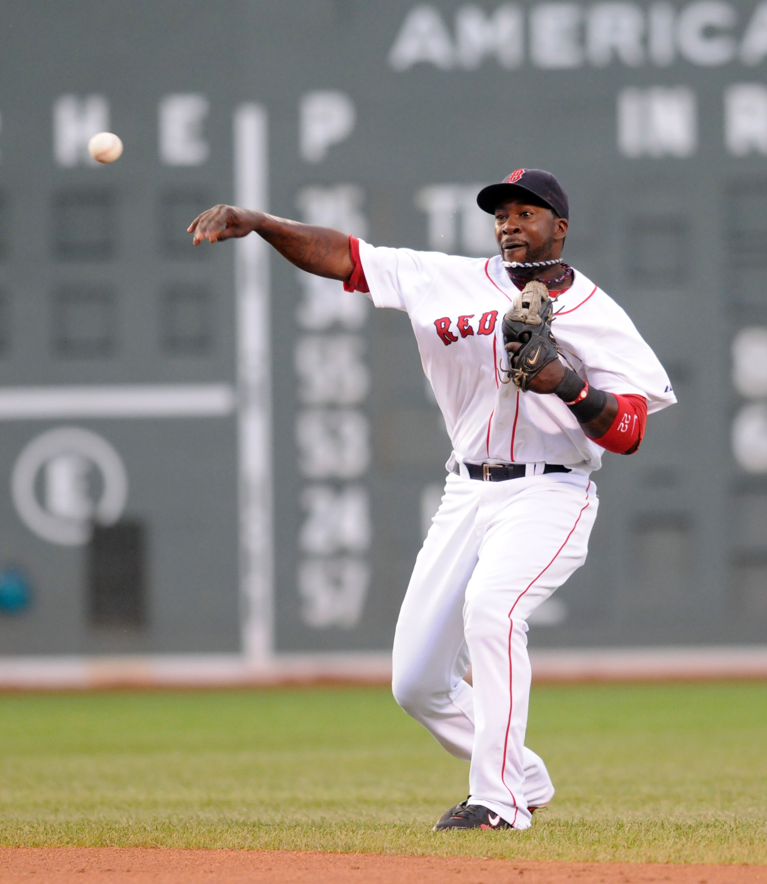 BOSTON, MA - AUGUST 5: Bill Hall #22 of the Boston Red Sox throws out a runner against the Cleveland Indians August 5, 2010 at Fenway Park in Boston, Massachusetts. (Photo by Darren McCollester/Getty Images)