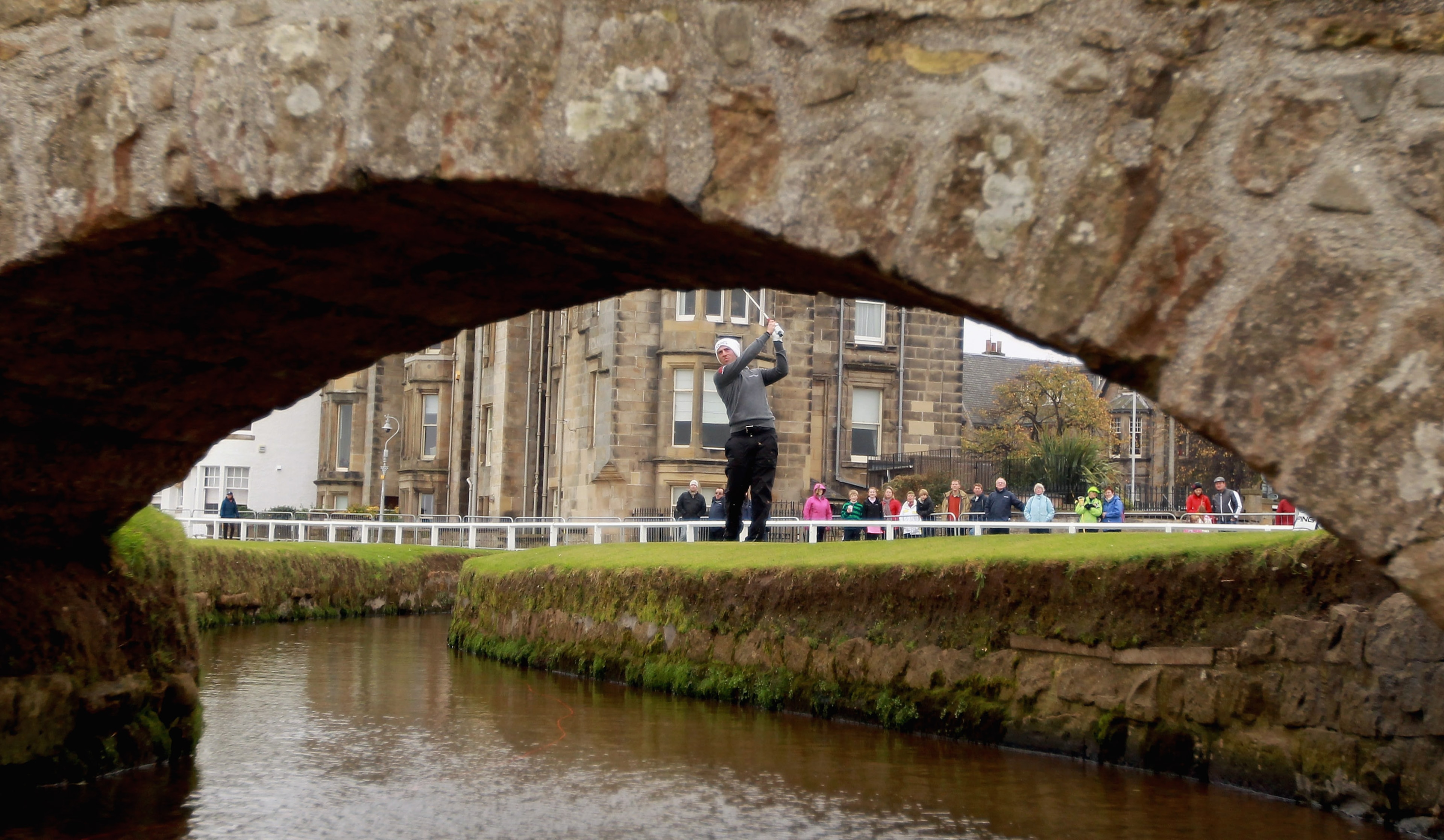 ST ANDREWS, SCOTLAND - OCTOBER 10:  John Parry of England plays his third shot to the first hole after driving into the burn during the final round of The Alfred Dunhill Links Championship at The Old Course on October 10, 2010 in St Andrews, Scotland.  (P
