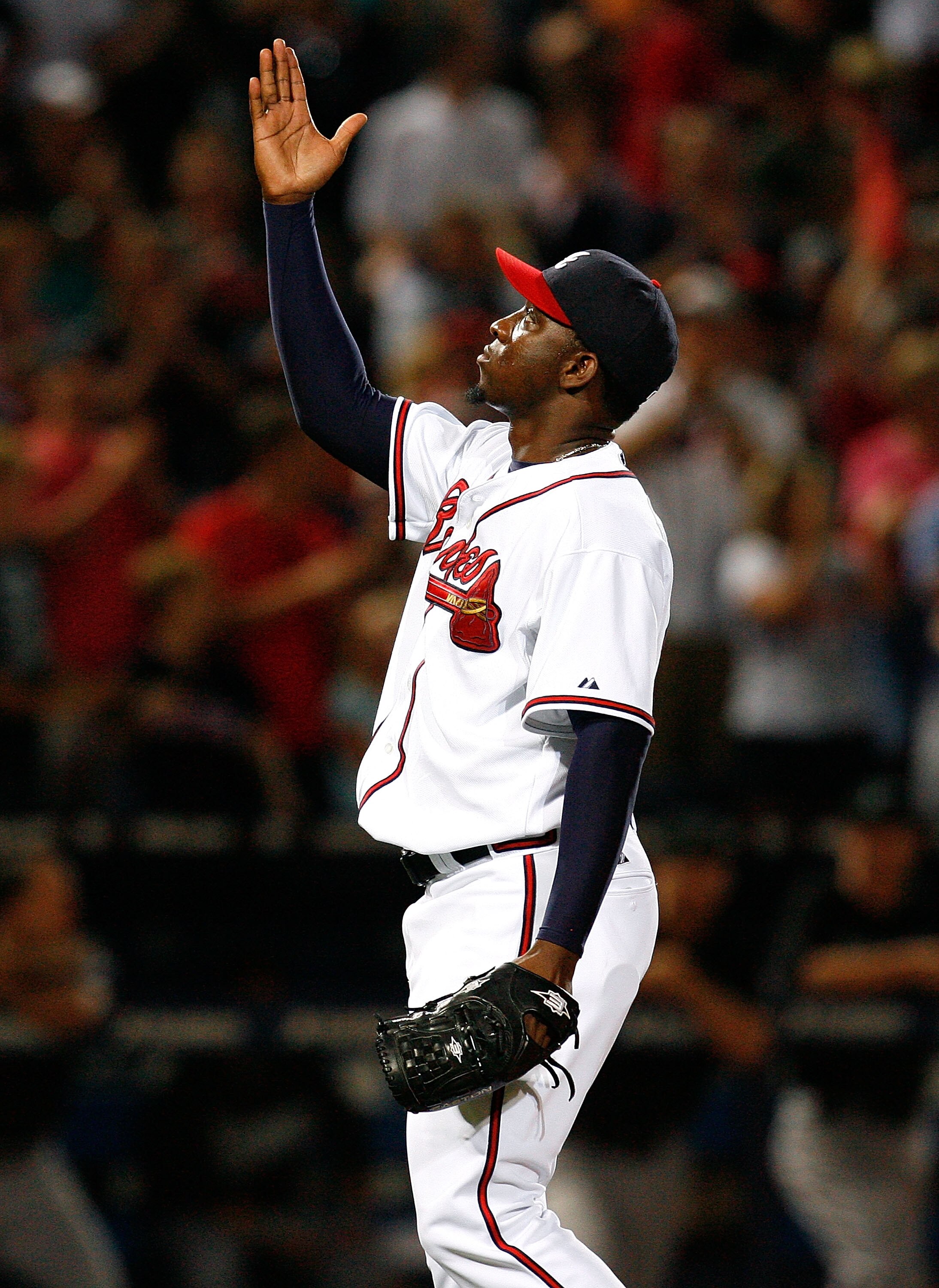 ATLANTA - AUGUST 22:  Closing pitcher Rafael Soriano #39 of the Atlanta Braves celebrates after defeating the Florida Marlins 4-3 on August 22, 2009 at Turner Field in Atlanta, Georgia.  (Photo by Kevin C. Cox/Getty Images)