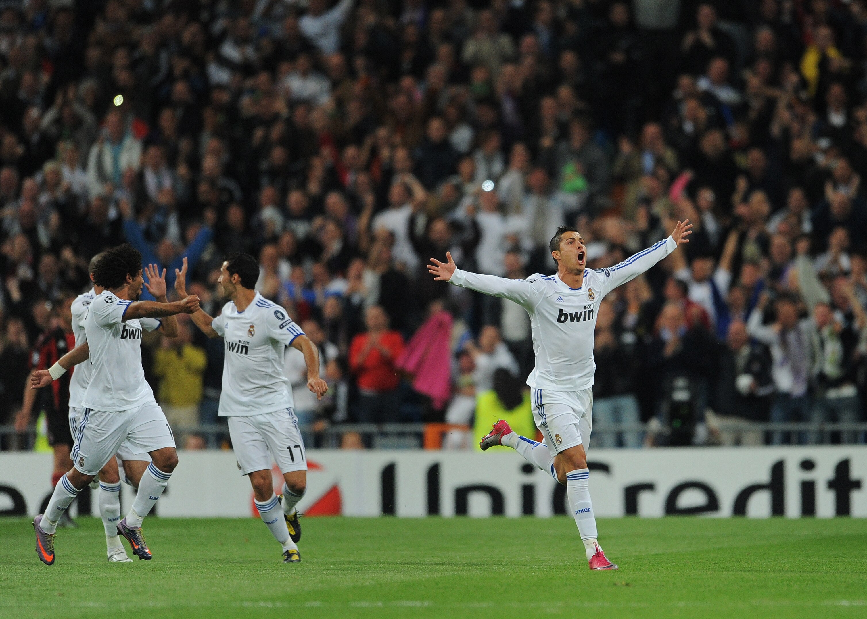 MADRID, SPAIN - OCTOBER 19:  Cristiano Ronaldo of Real Madrid celebrates scoring his sides opening goal from a free kick during the UEFA Champions League group G match between Real Madrid and AC Milan at the Estadio Santiago Bernabeu on October 19, 2010 i