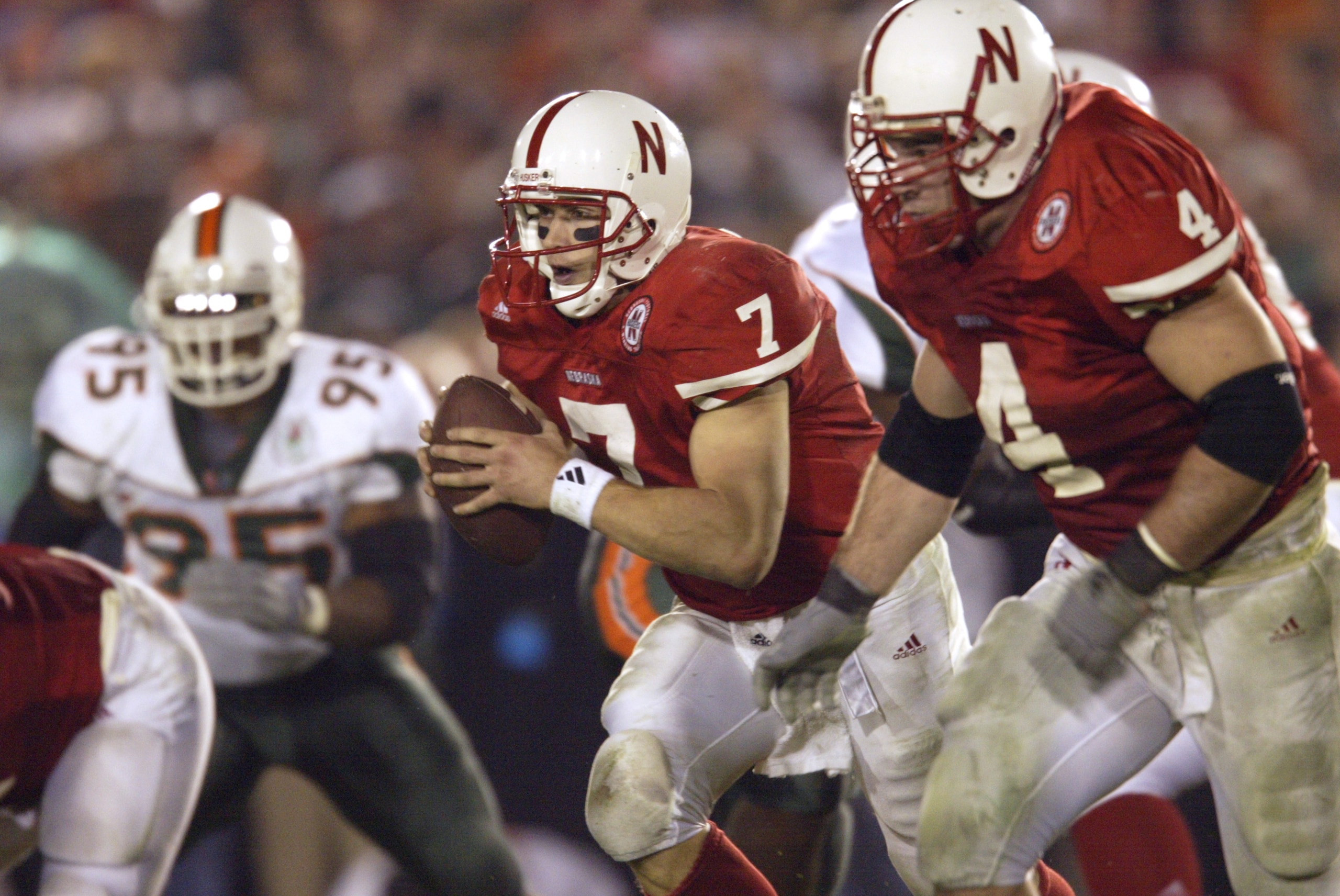 3 Jan 2002:  Quarterback Eric Crouch of Nebraska drops back to pass behind the blocking of teammate Terrell Butler #4 during the Rose Bowl National Championship game against Miami at the Rose Bowl in Pasadena, California.  Miami won the game 37-14, winnin