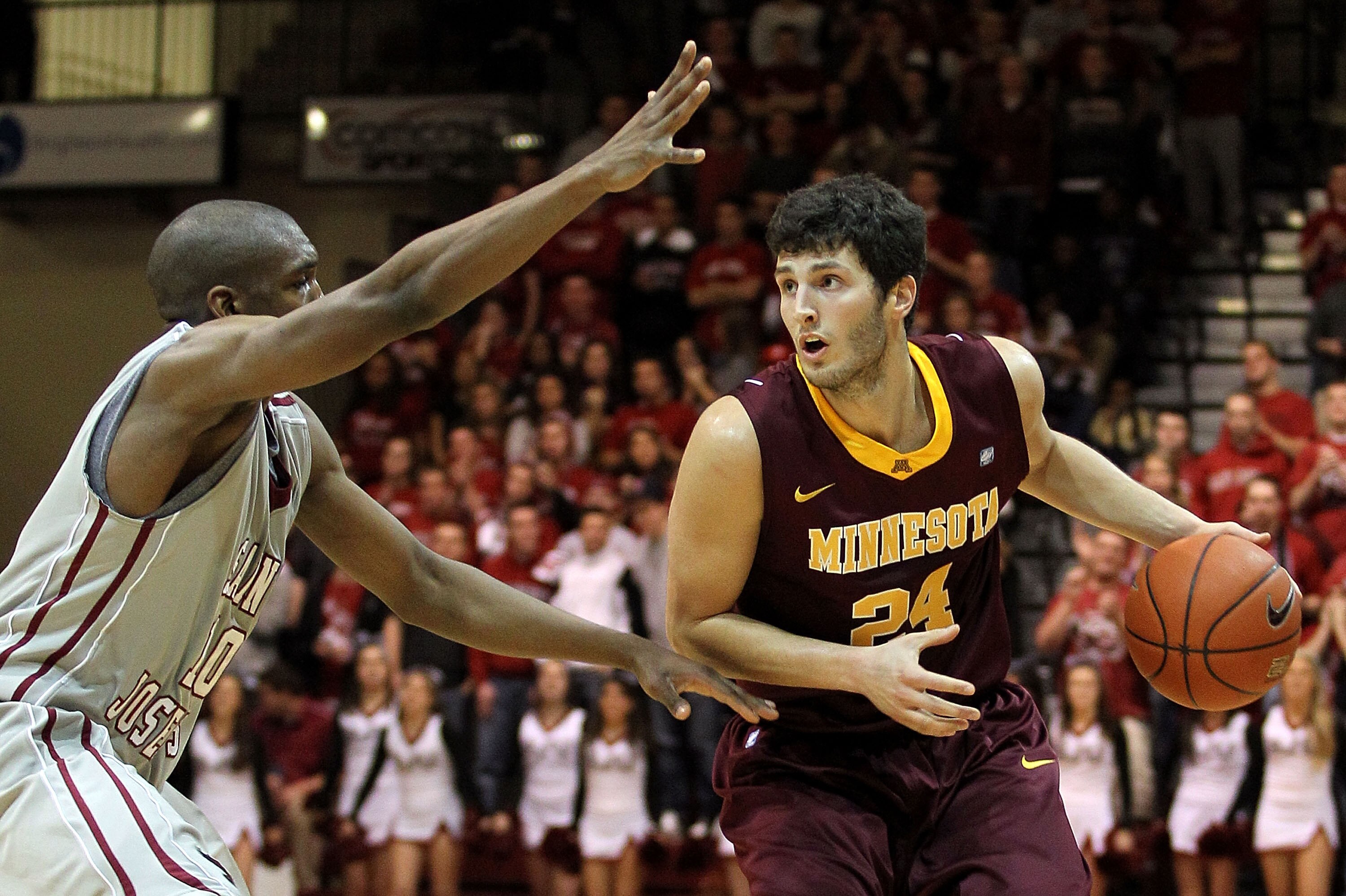 PHILADELPHIA, PA - DECEMBER 08:  Blake Hoffarber #24 of the Minnesota Golden Gophers drives against Langston Galloway #10 of the St. Joseph's Hawks at Michael J. Hagan Arena on December 8, 2010 in Philadelphia, Pennsylvania.  (Photo by Chris Chambers/Gett