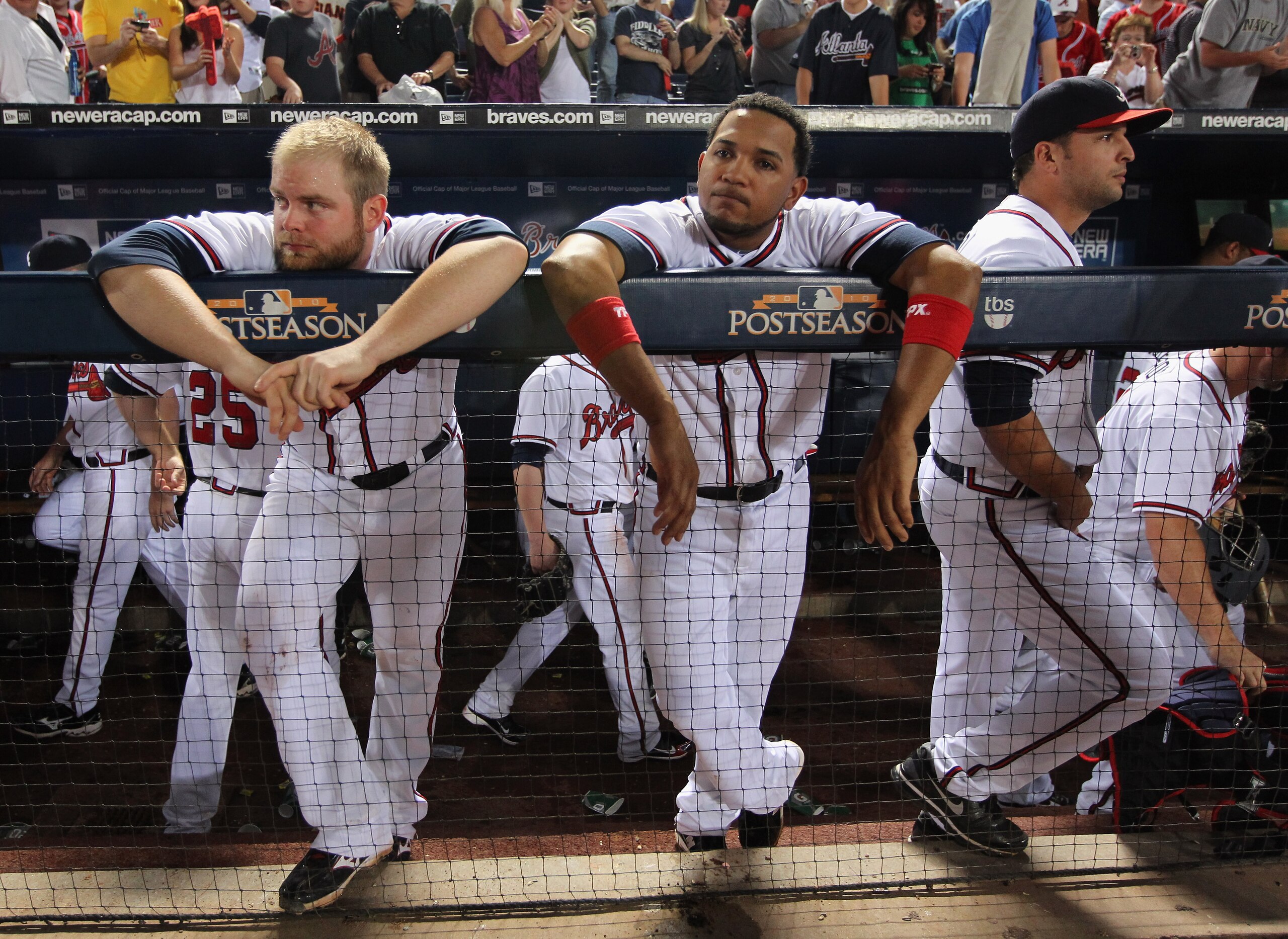 ATLANTA - OCTOBER 11:  Brian McCann #16, Diory Hernandez #19 and Martin Prado of the Atlanta Braves react after the San Francisco Giants defeated the Braves 3-2 to win Game Four of the NLDS of the 2010 MLB Playoffs on October 11, 2010  at Turner Field in