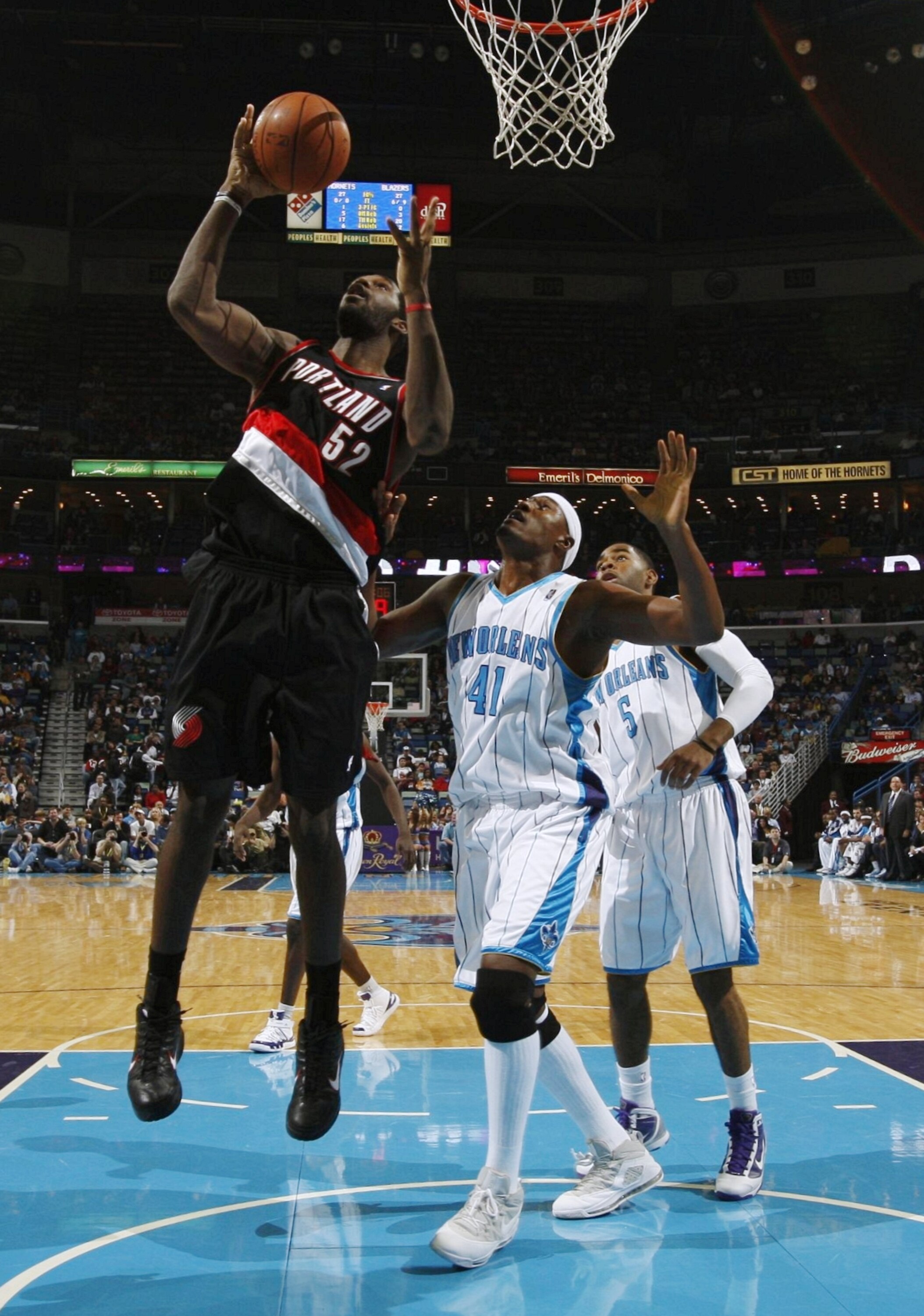 NEW ORLEANS - NOVEMBER 13:  Greg Oden #52 of the Portland Trail Blazers rebounds the ball against James Posey #41 of the New Orleans Hornets during the game at New Orleans Arena on November 13, 2009 in New Orleans, Louisiana.  NOTE TO USER: User expressly
