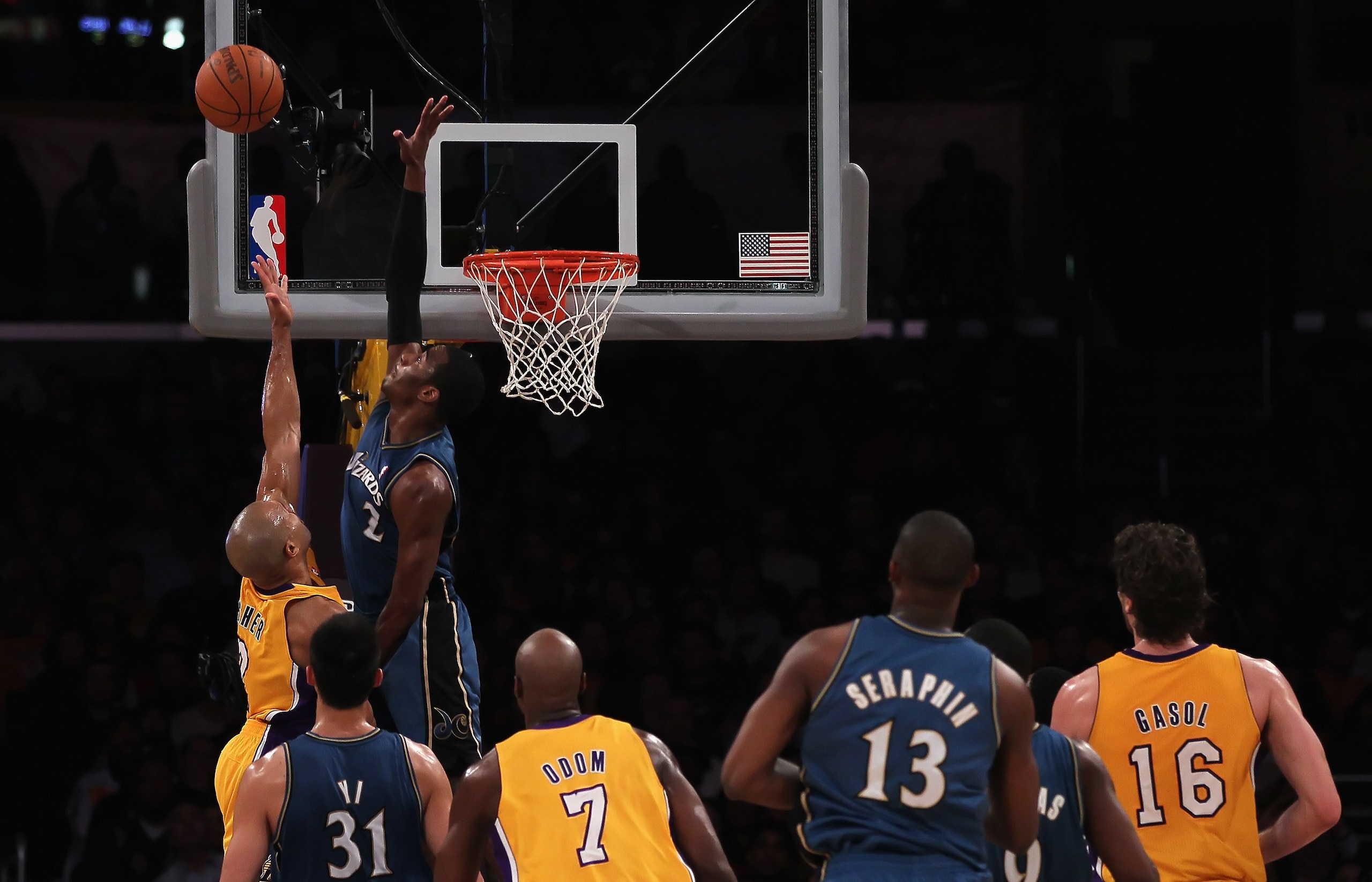LOS ANGELES, CA - DECEMBER 07:  John Wall #2 of the Washington Wizards blocks a shot by Derek Fisher (L) #2 of the Los Angeles Lakers in the second half at Staples Center on December 7, 2010 in Los Angeles, California. The Lakers defeated the Wizards 115-